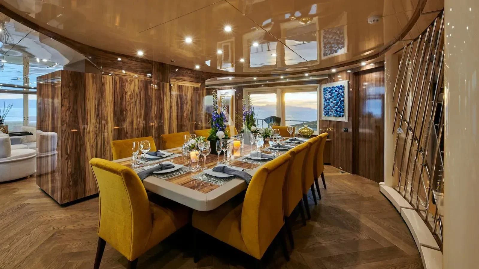 a dining room with a table and chairs aboard PROMETHEUS I Yacht for Charter