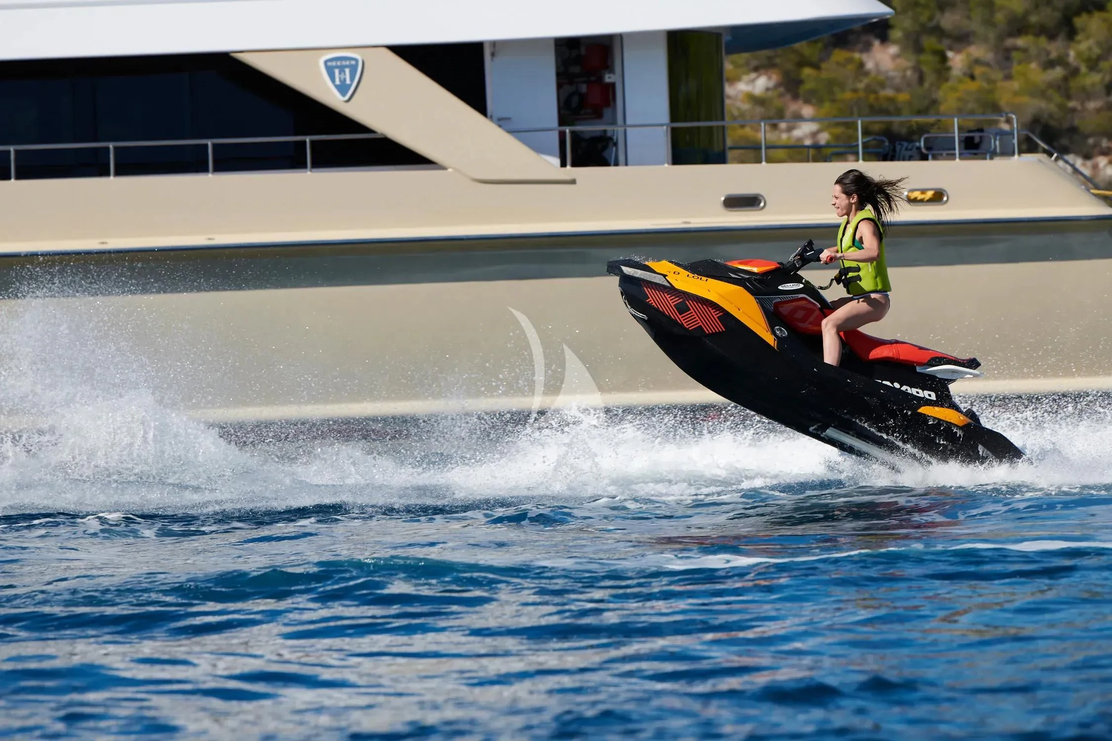 a man on a jet ski aboard PROMETHEUS I Yacht for Charter