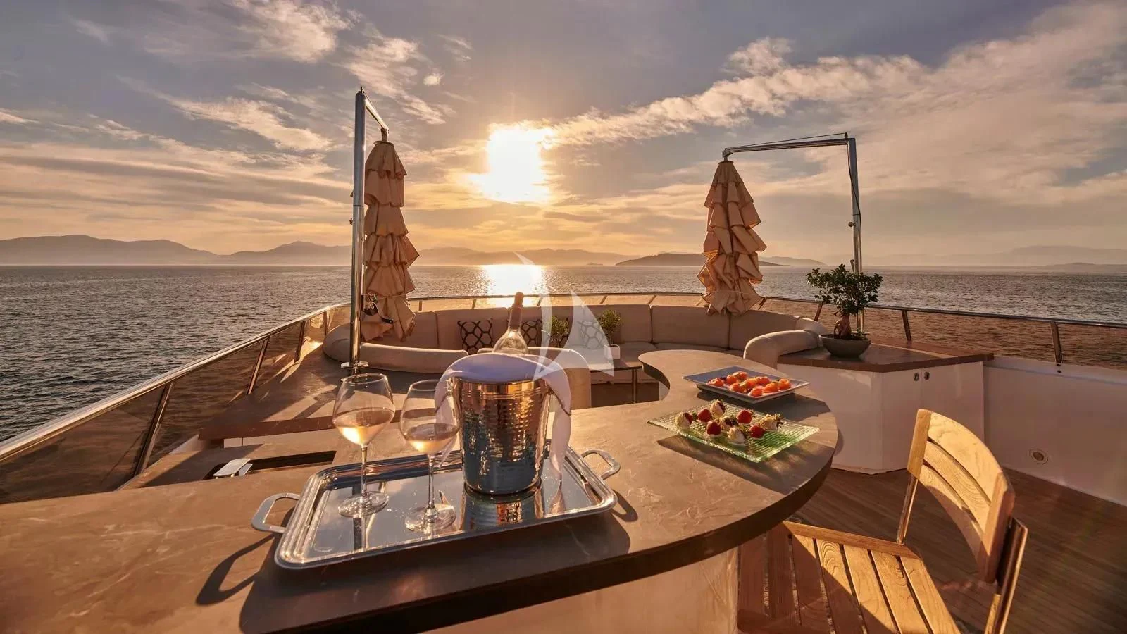a table with food and drinks on it aboard PROMETHEUS I Yacht for Charter