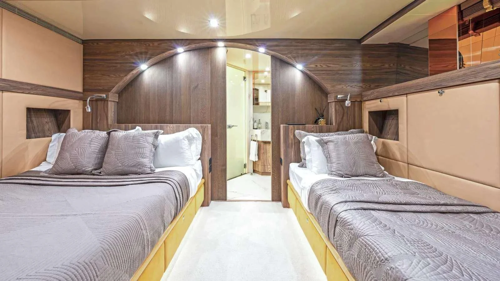 a couple of beds in a room aboard PROMETHEUS I Yacht for Charter