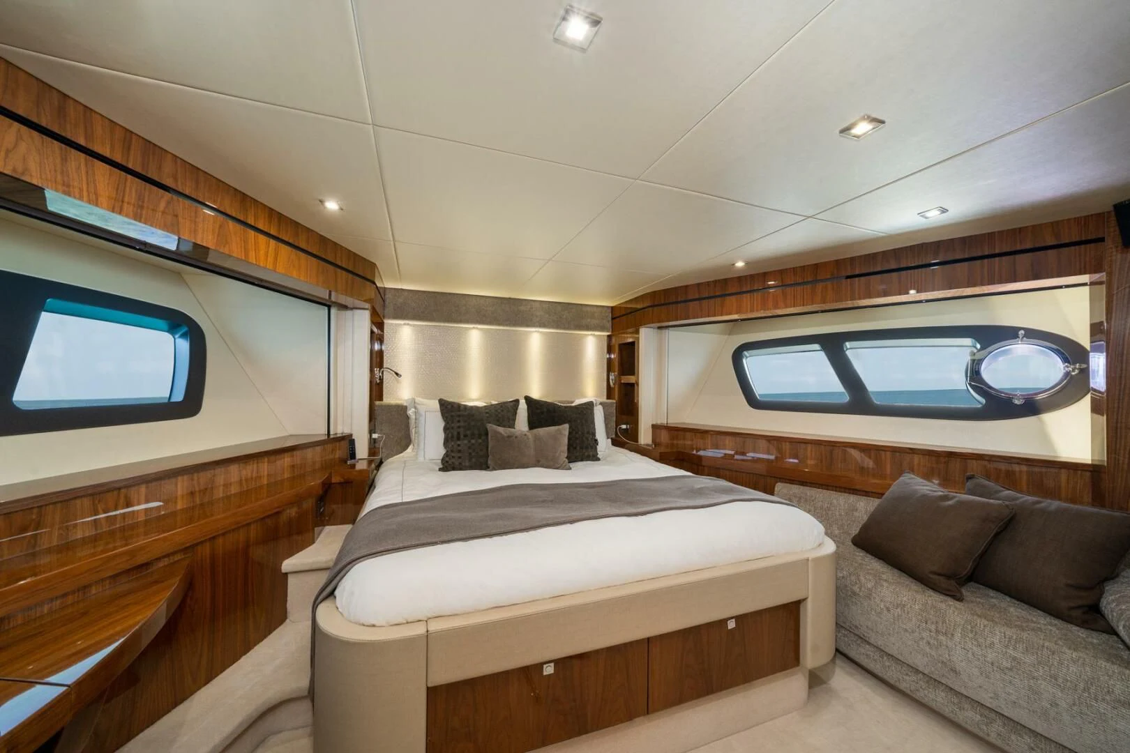 a room with a bed and a couch aboard EBRA Yacht for Sale