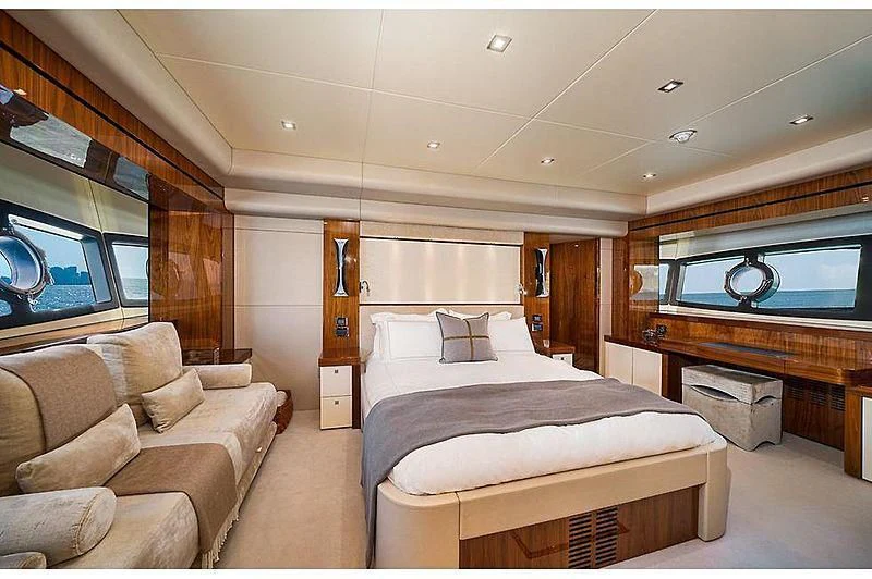 a room with a bed and a couch aboard EBRA Yacht for Sale