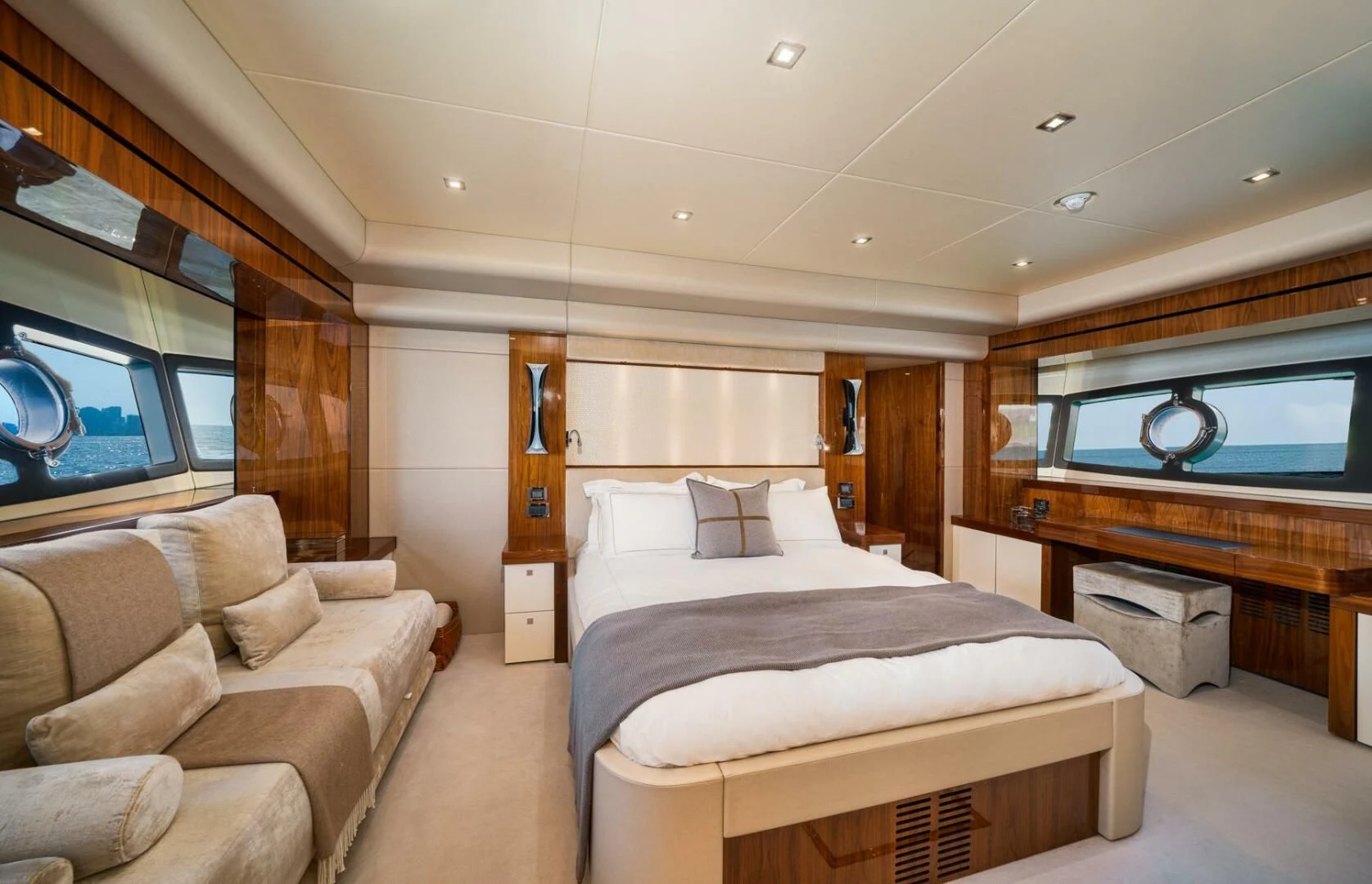 a room with a bed and a couch aboard EBRA Yacht for Sale
