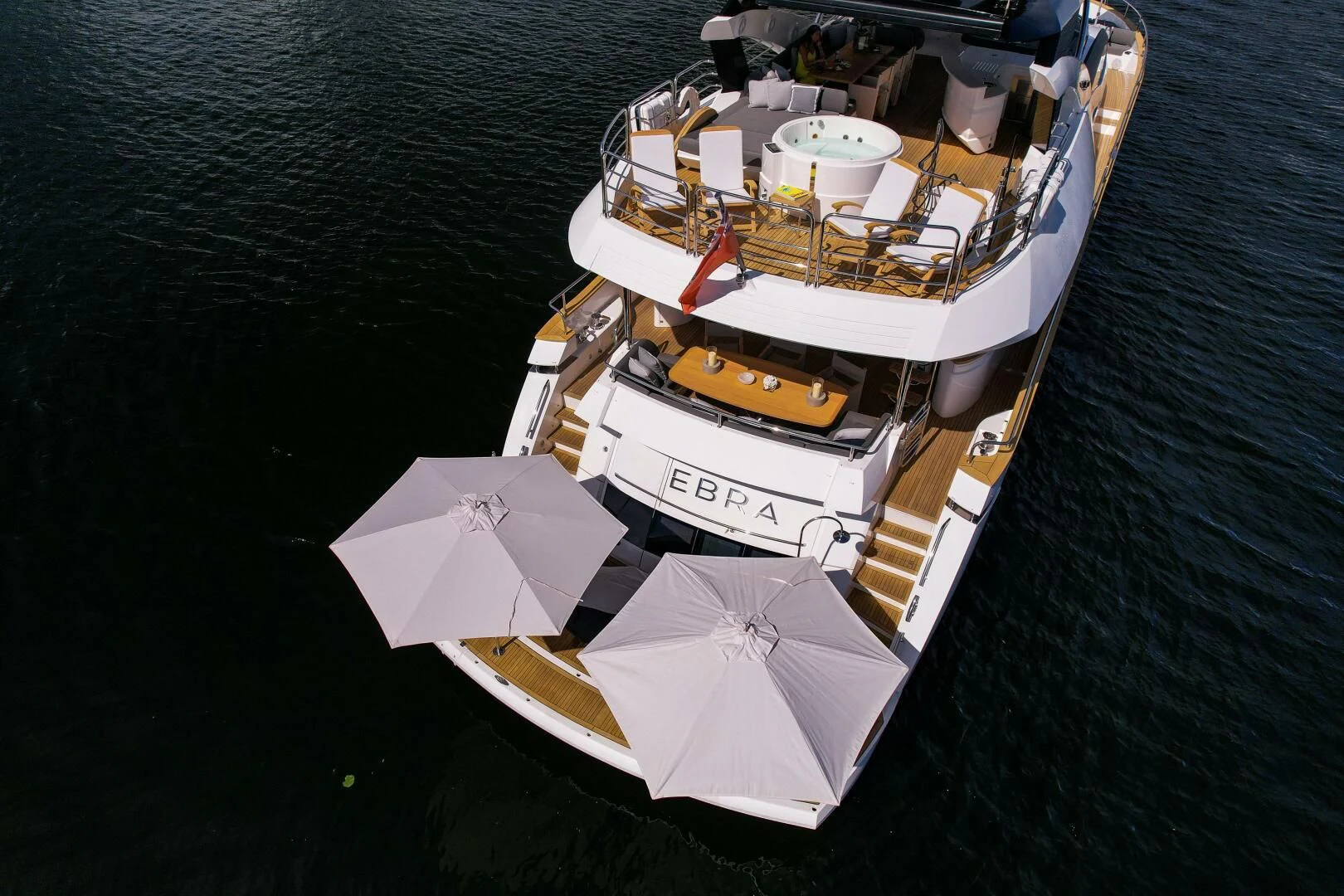 a boat with umbrellas on it aboard EBRA Yacht for Sale