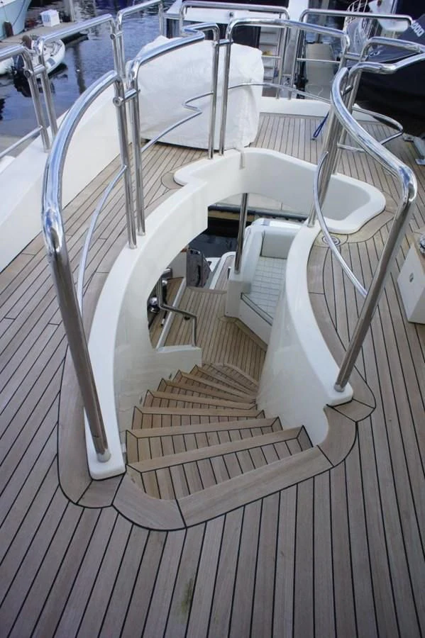 a white chair on a deck aboard CASPIAN Yacht for Sale