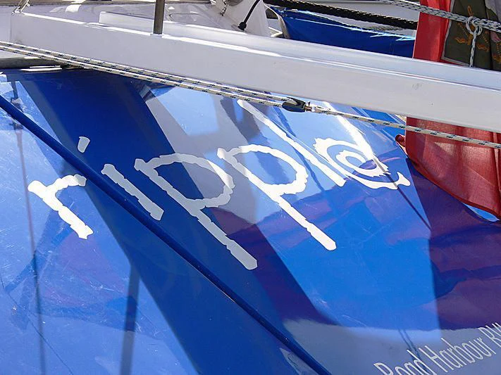 a blue and white boat aboard RIPPLE Yacht for Sale