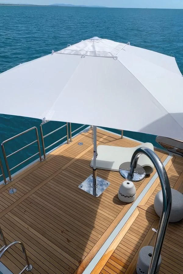 a white umbrella on a deck aboard ECLIPSE Yacht for Sale