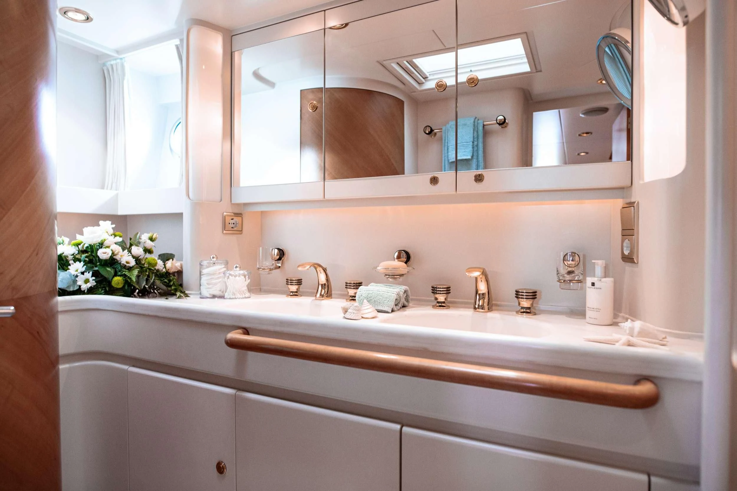 a bathroom with a large mirror aboard SCARENA Yacht for Charter
