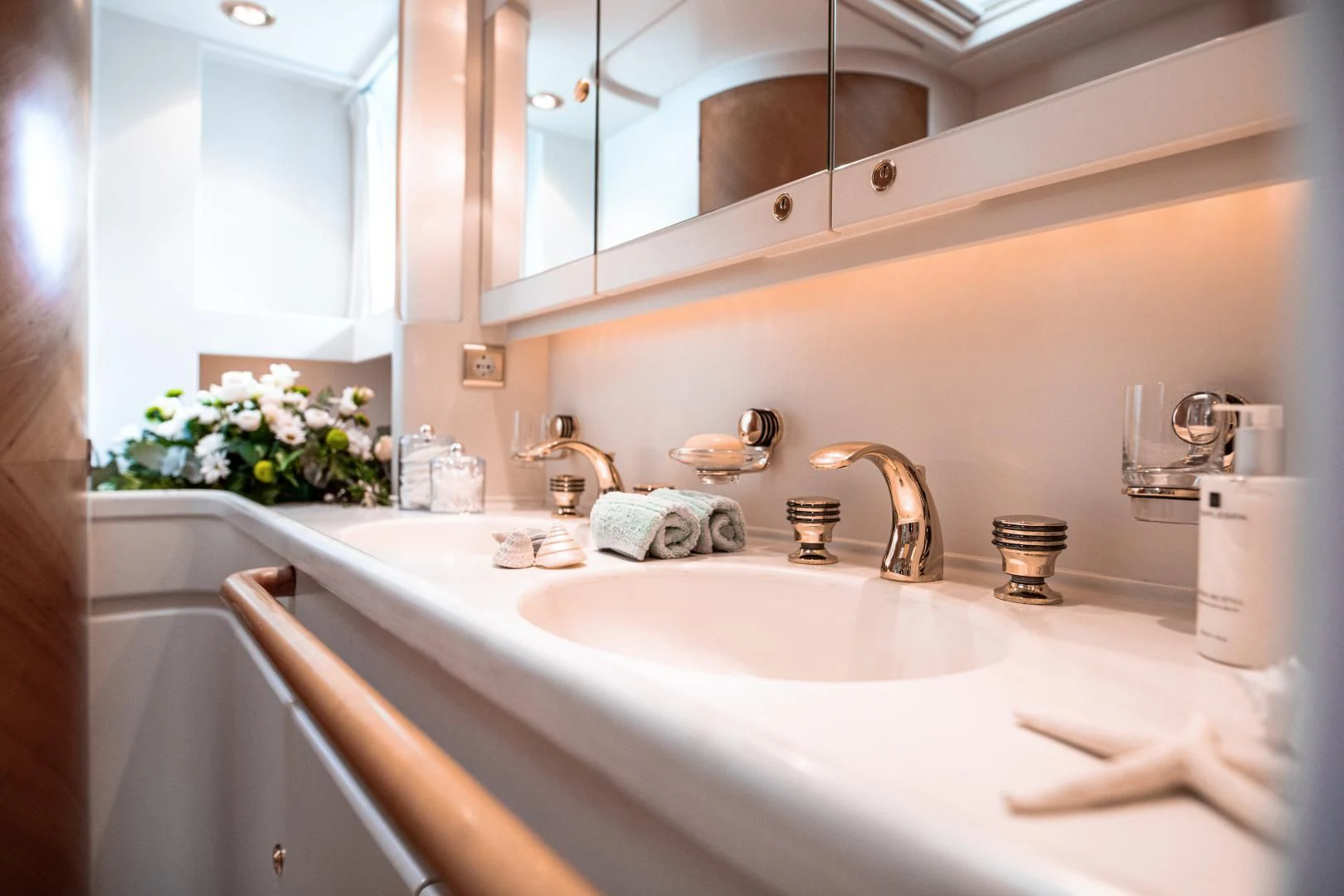 a bathroom sink with a mirror above it aboard SCARENA Yacht for Charter