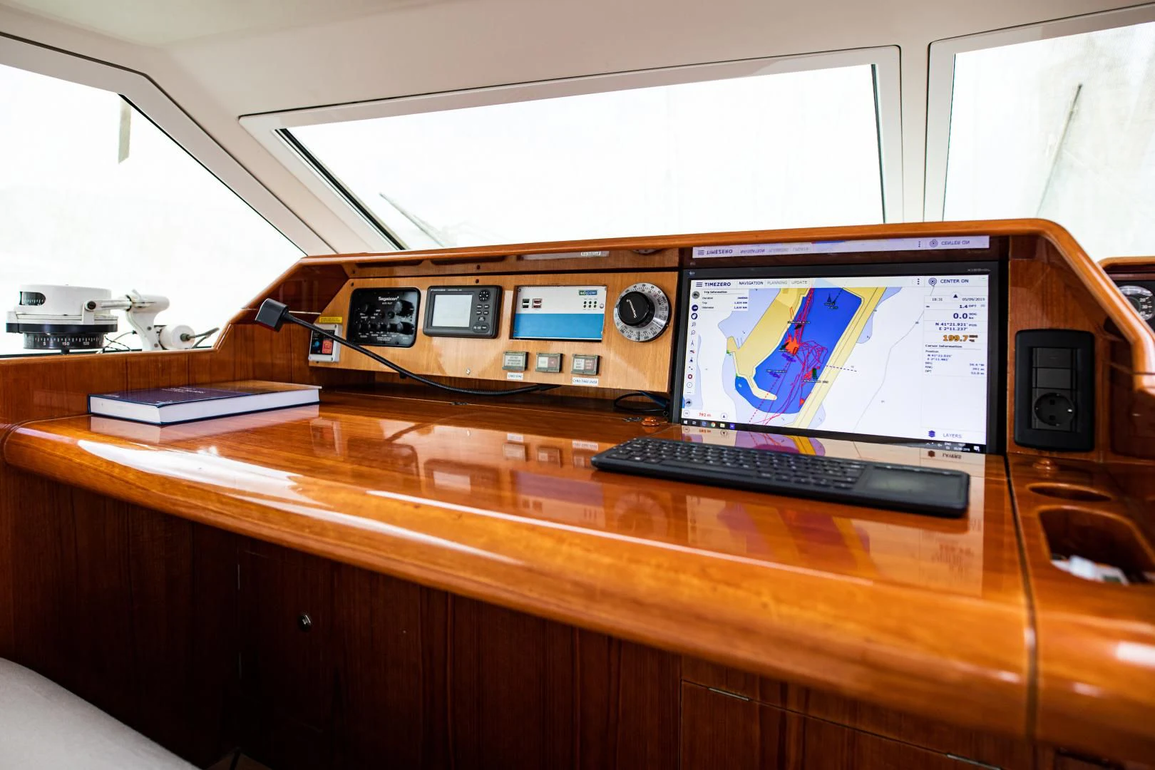 a desk with a couple of electronic devices on it aboard SCARENA Yacht for Charter