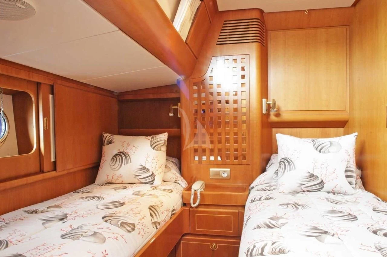 a couple of beds in a room aboard SCARENA Yacht for Charter