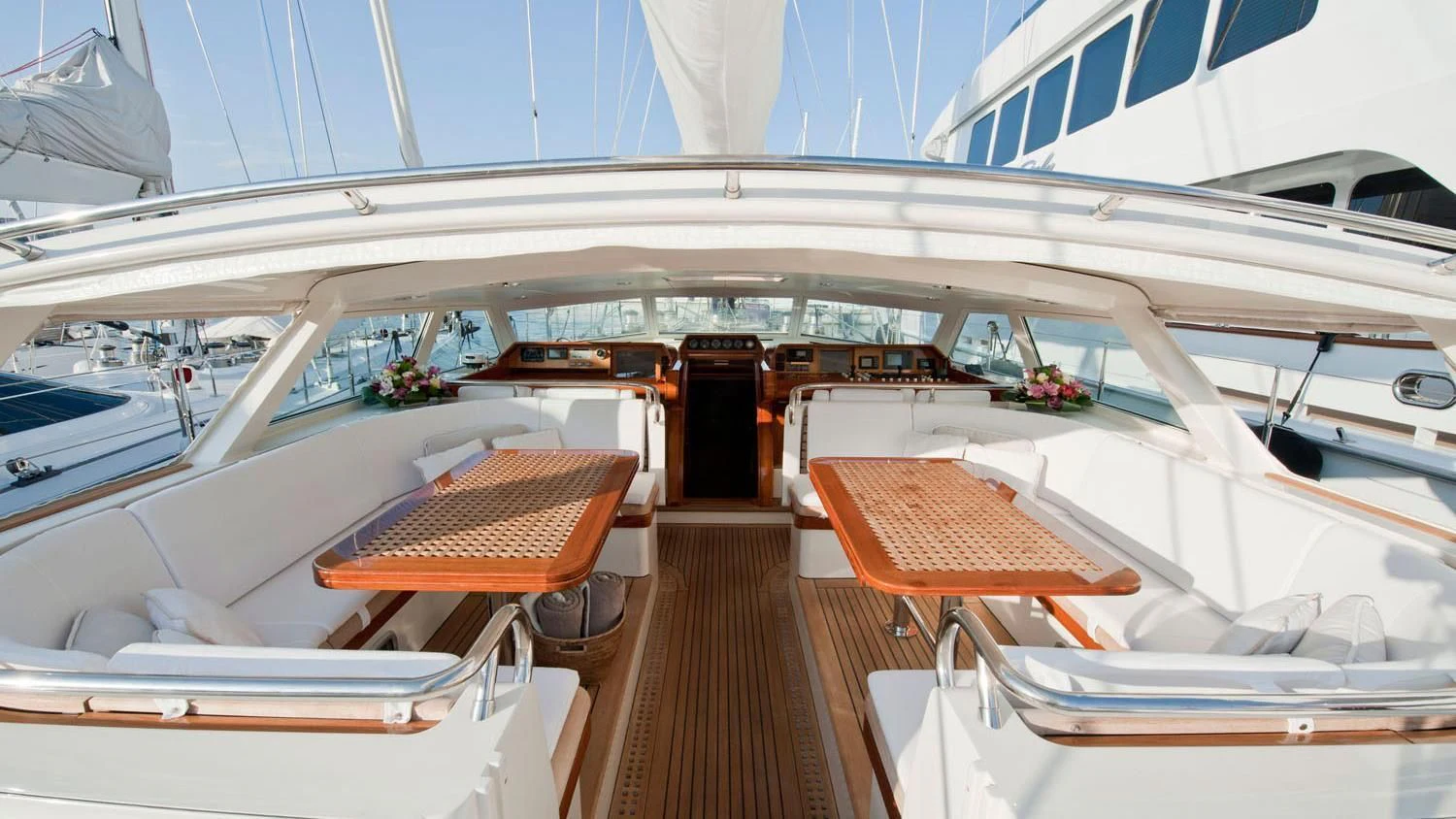 a boat with many seats aboard SCARENA Yacht for Charter