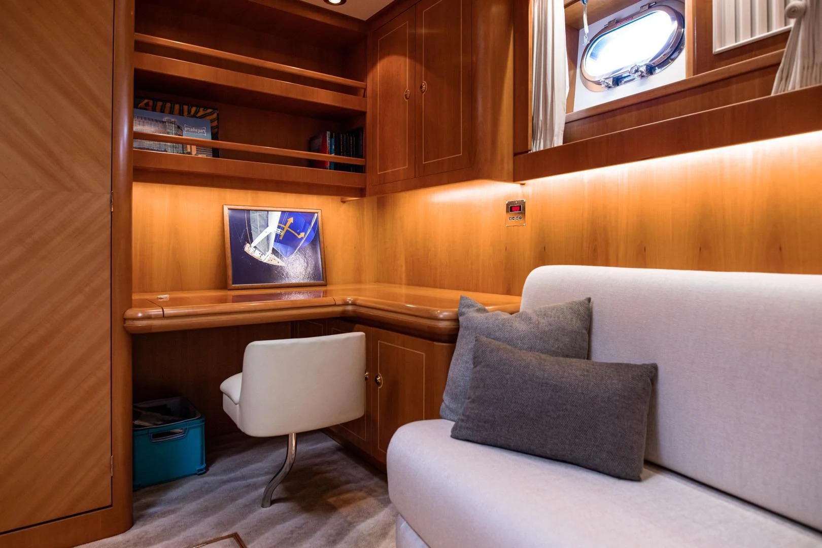 a room with a couch and a chair aboard SCARENA Yacht for Charter