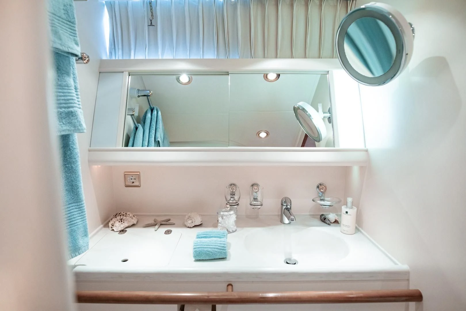 a bathroom with a large mirror aboard SCARENA Yacht for Charter