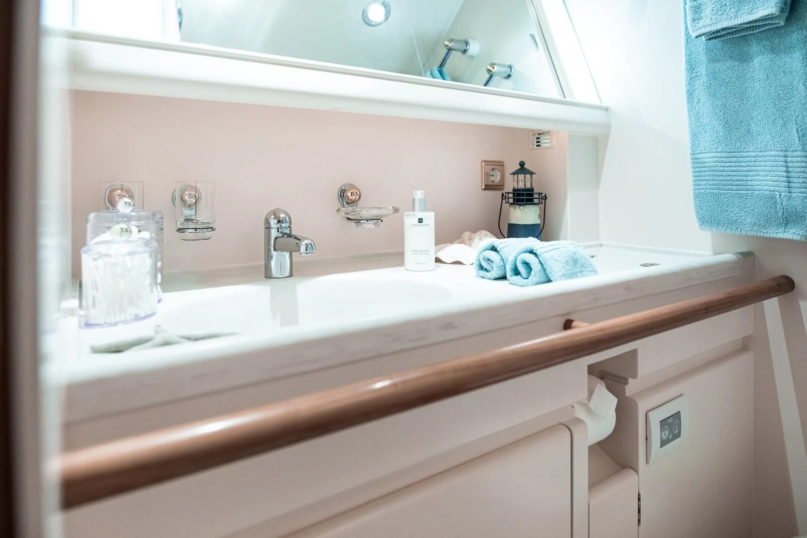 a bathroom sink with a towel aboard SCARENA Yacht for Charter