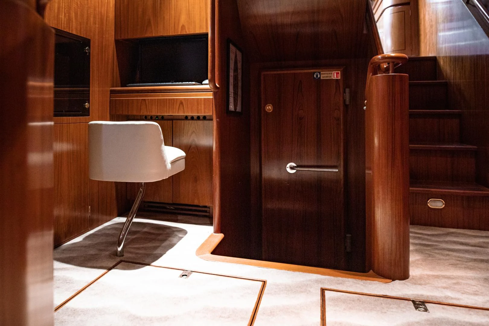 a chair next to a door aboard SCARENA Yacht for Charter