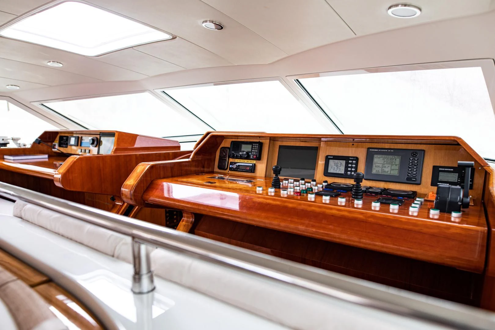a table with many electronic devices on it aboard SCARENA Yacht for Charter