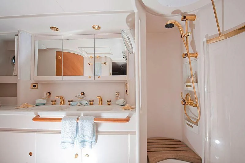 a bathroom with a shower and sink aboard SCARENA Yacht for Charter