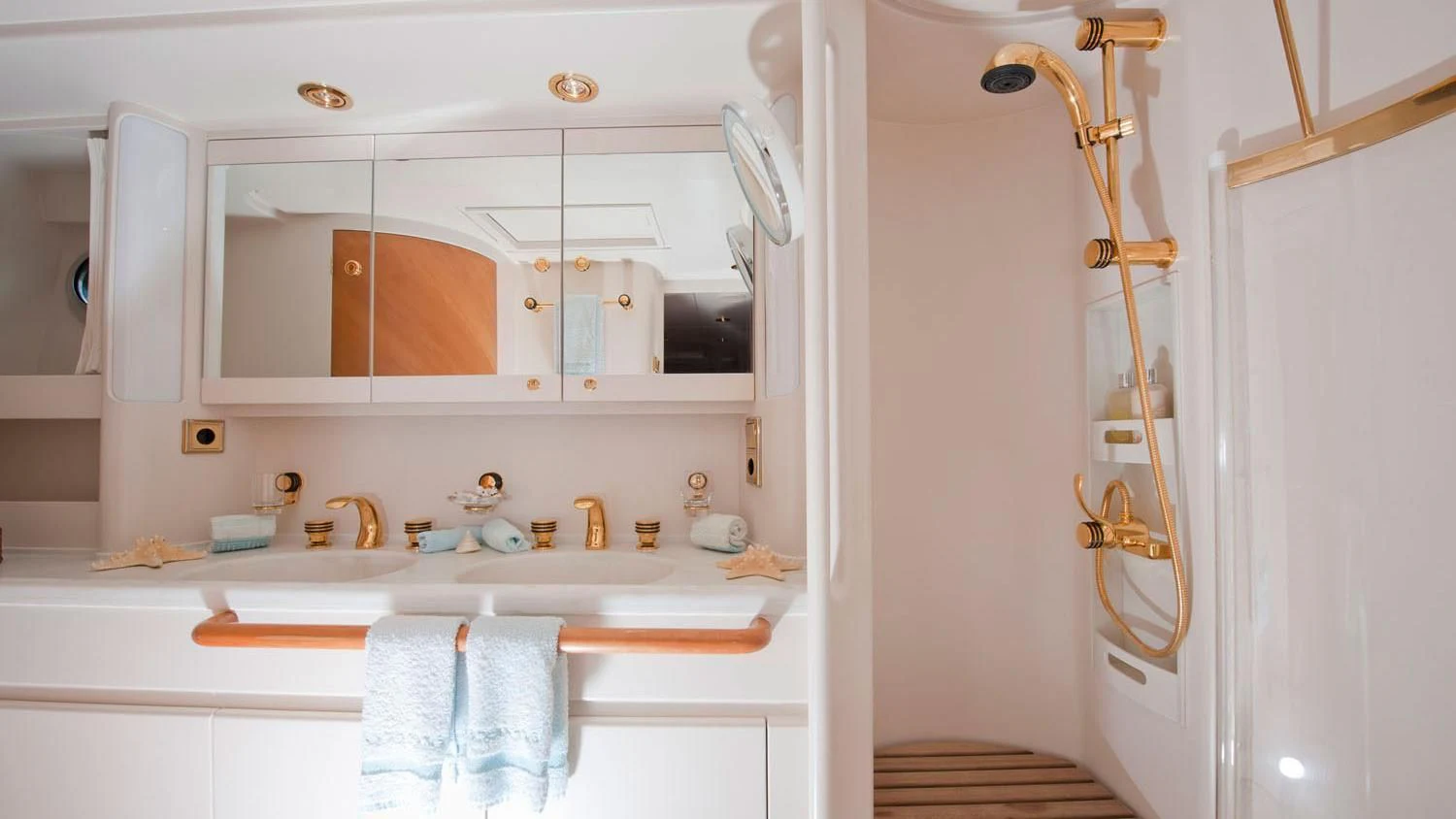 a bathroom with a sink and a shower aboard SCARENA Yacht for Charter