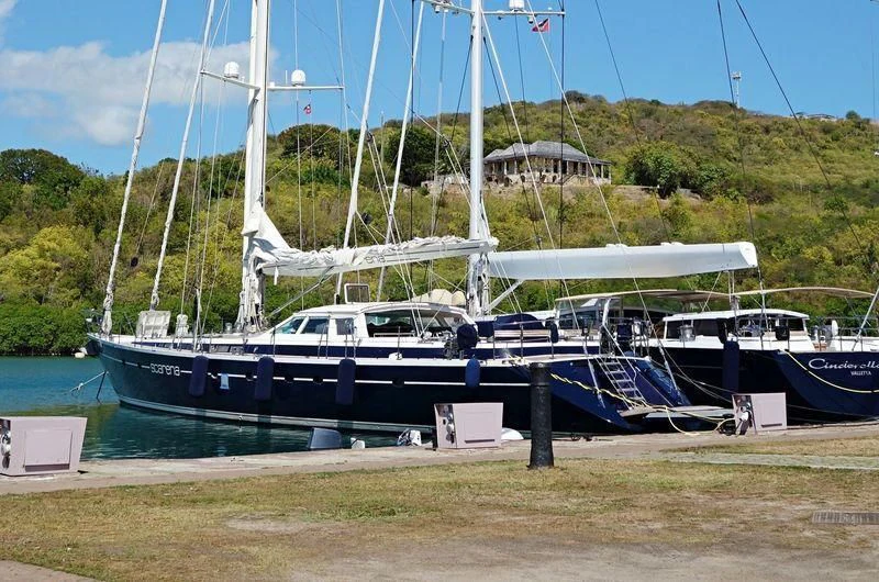 a boat docked at a pier aboard SCARENA Yacht for Charter