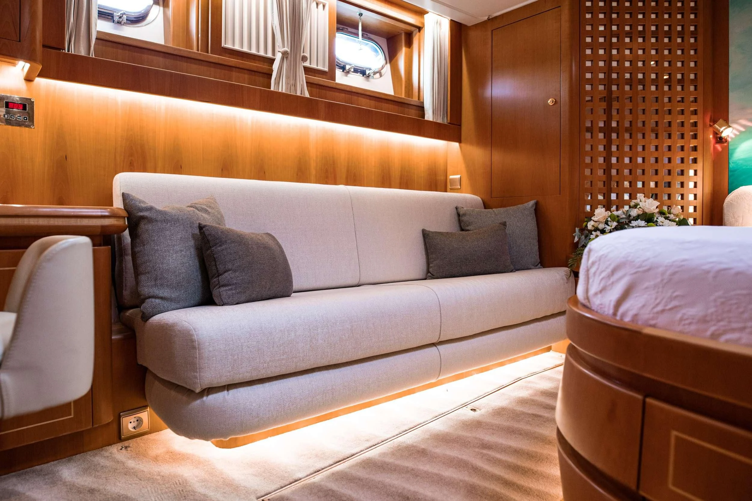 a bed and a couch in a room aboard SCARENA Yacht for Charter