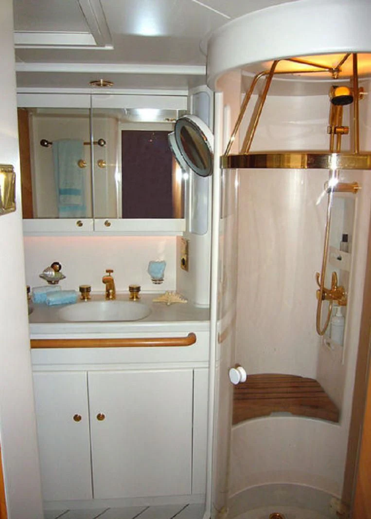 a bathroom with a sink and a mirror aboard SCARENA Yacht for Charter