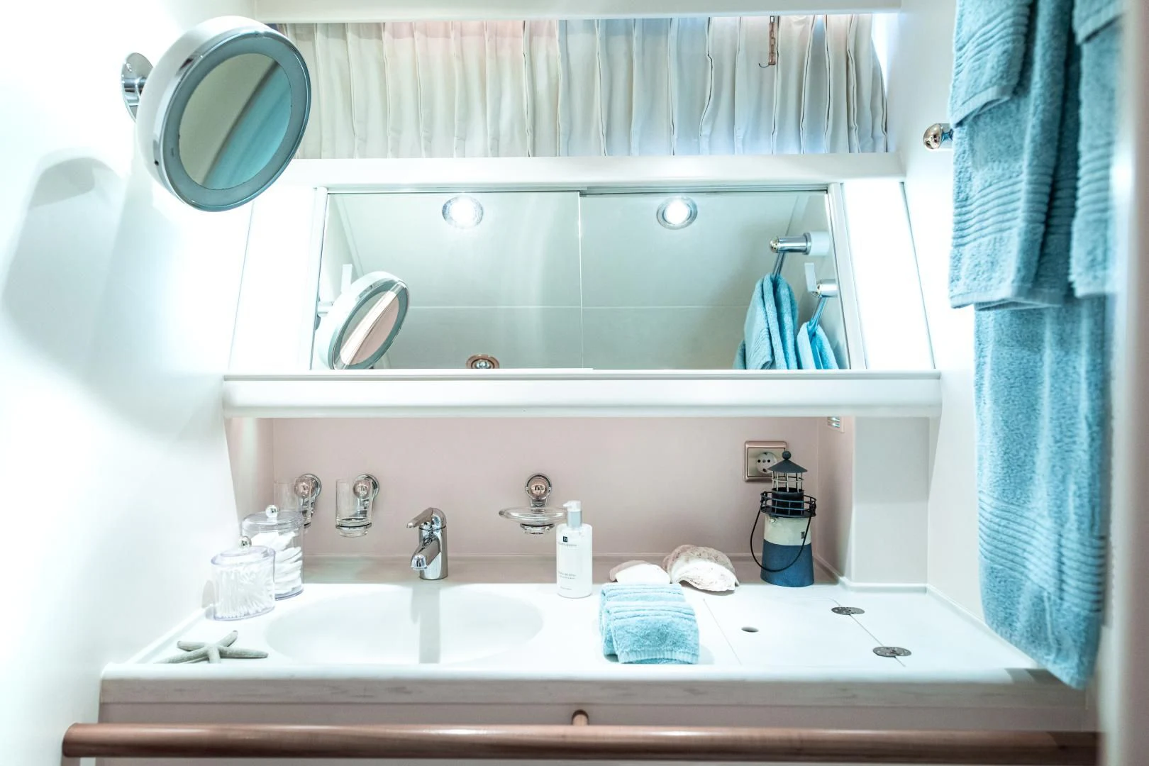 a bathroom with a large mirror aboard SCARENA Yacht for Charter