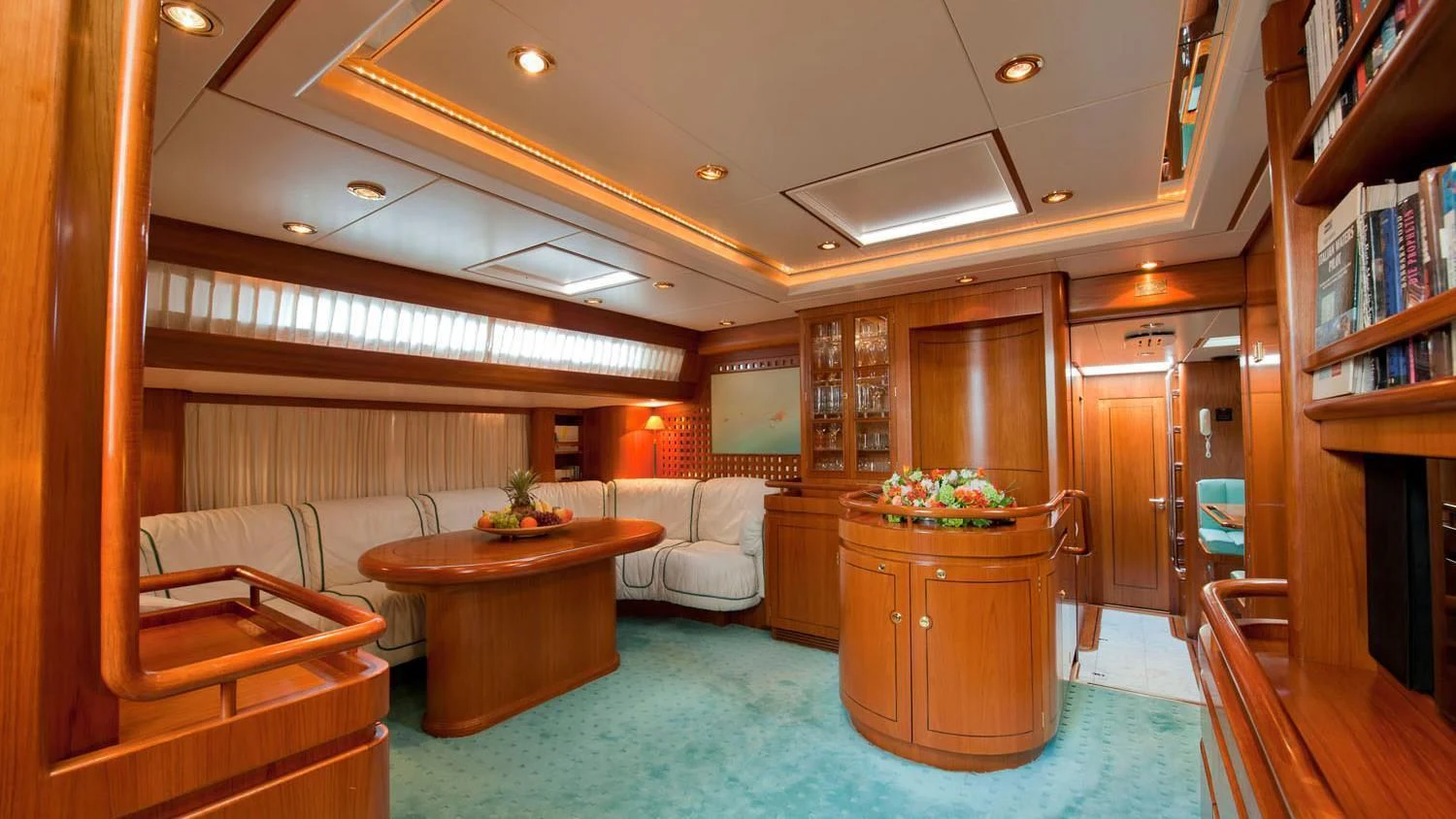 a living room with a blue rug aboard SCARENA Yacht for Charter