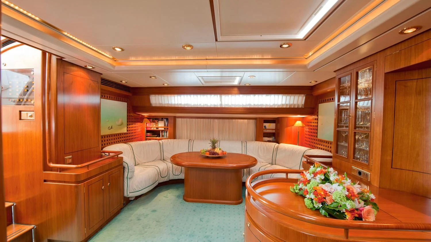 a living room with a couch and a table aboard SCARENA Yacht for Charter