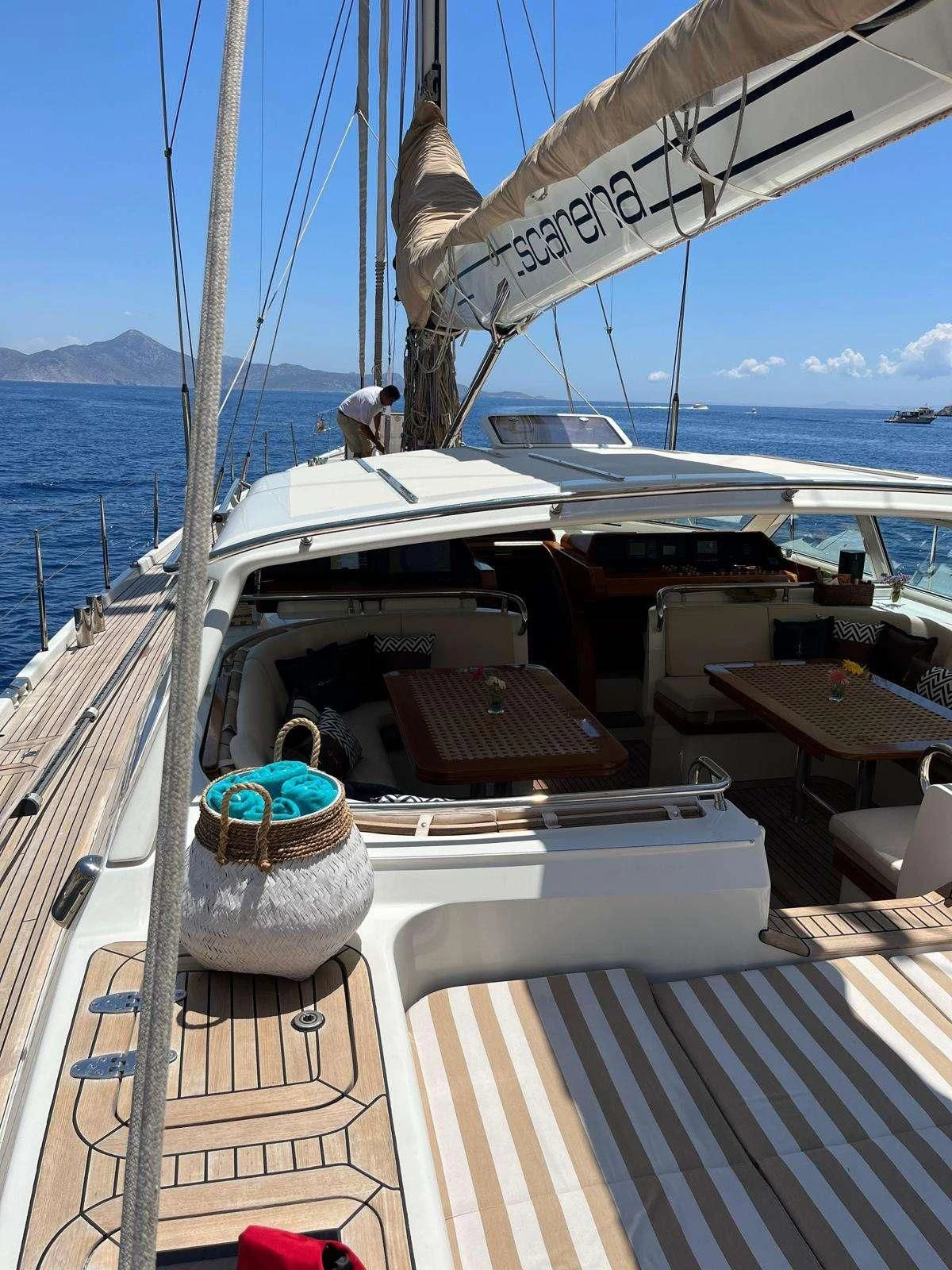 a boat with a chair on the deck aboard SCARENA Yacht for Charter