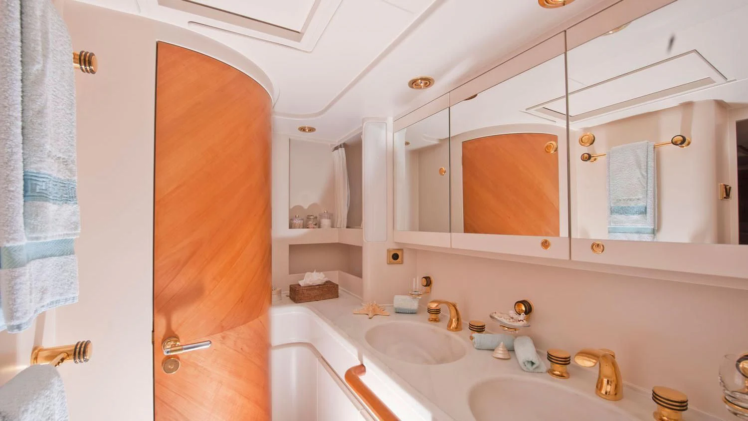 a bathroom with a sink and a mirror aboard SCARENA Yacht for Charter