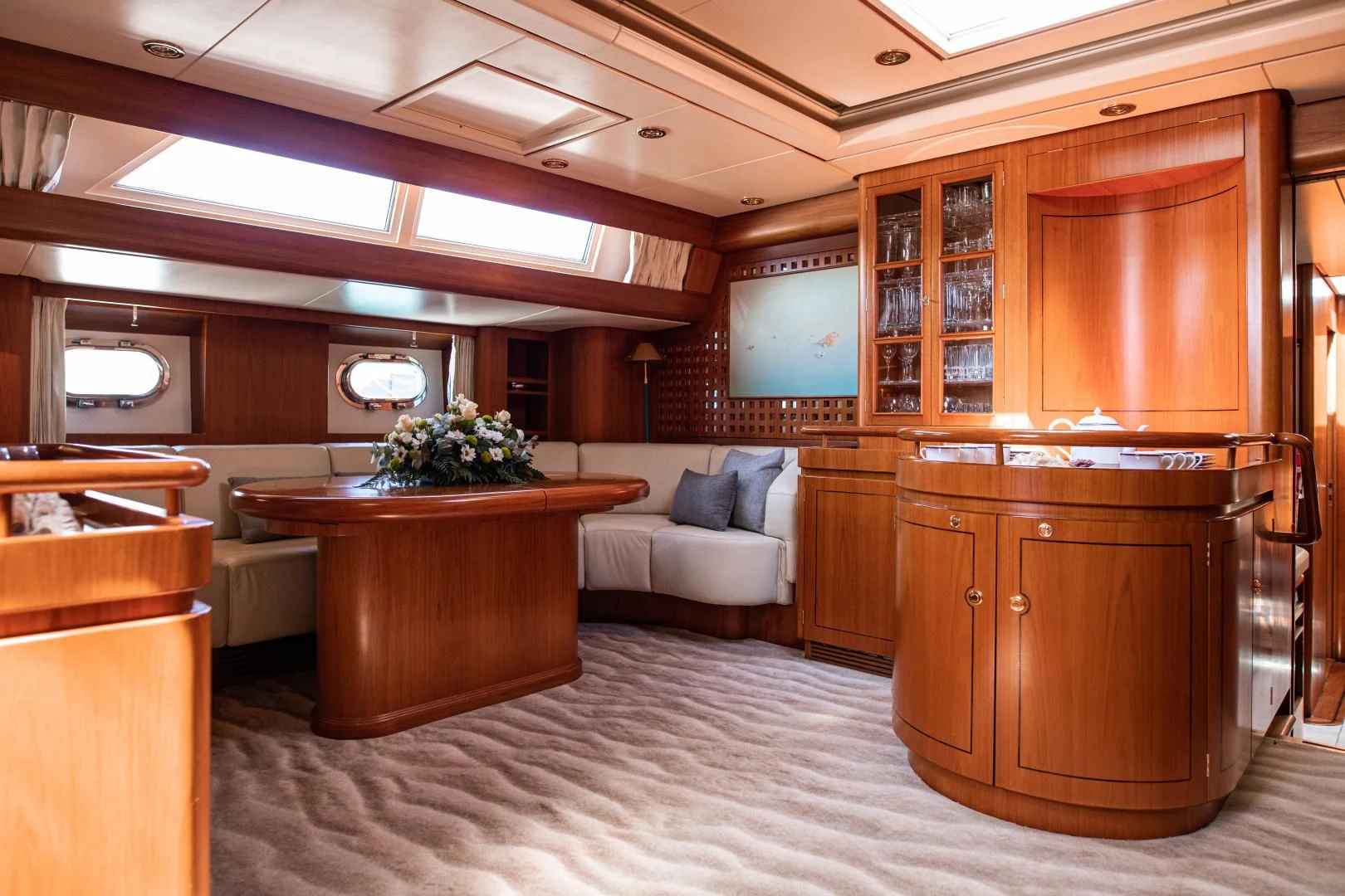 a room with a couch and a table aboard SCARENA Yacht for Charter