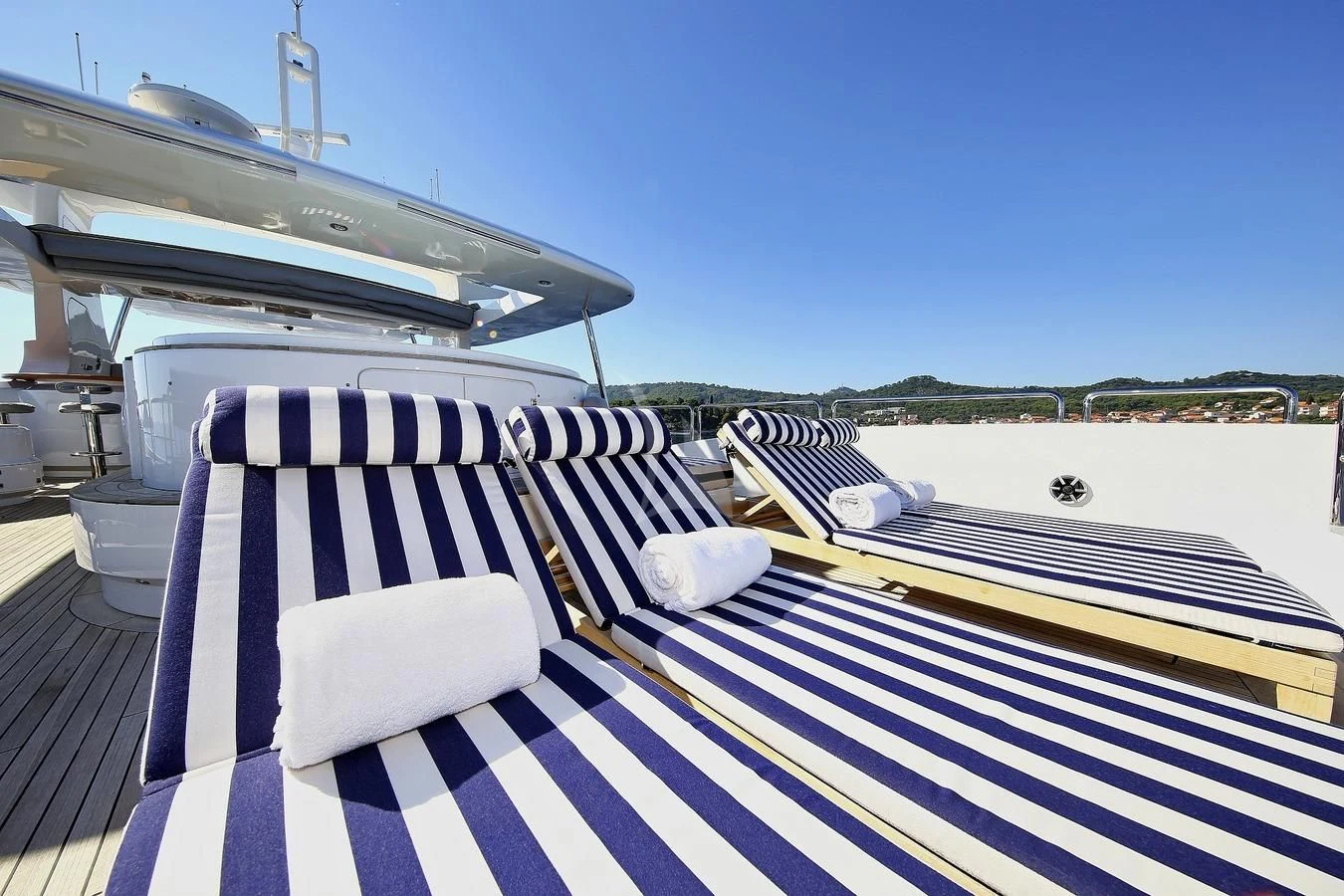 a deck with a deck and a boat on it aboard ARTEMY Yacht for Sale