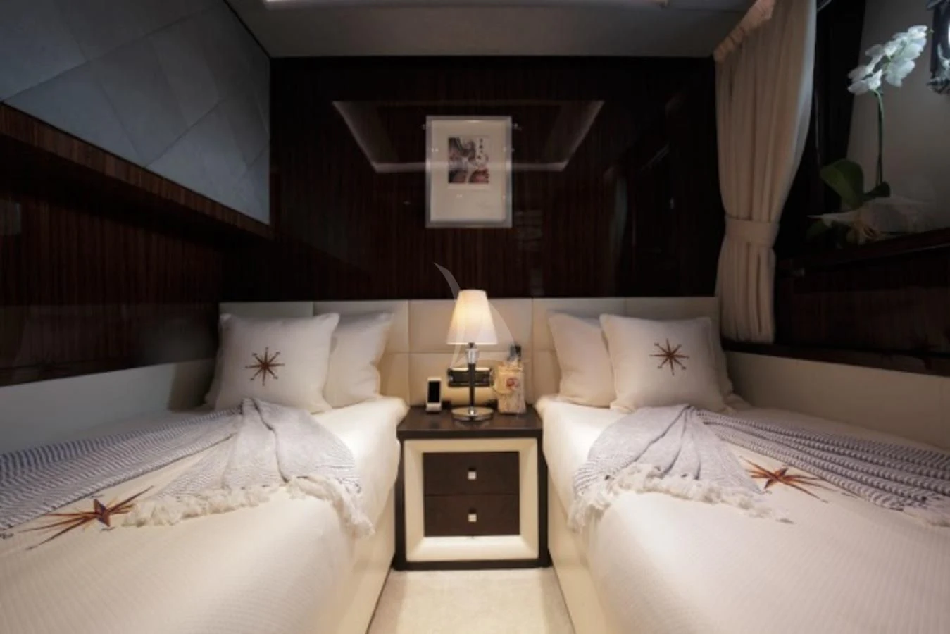 a room with beds and a lamp aboard ARTEMY Yacht for Sale