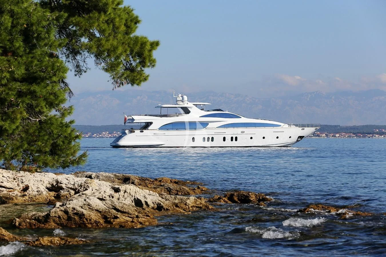 a white yacht on the water aboard ARTEMY Yacht for Sale