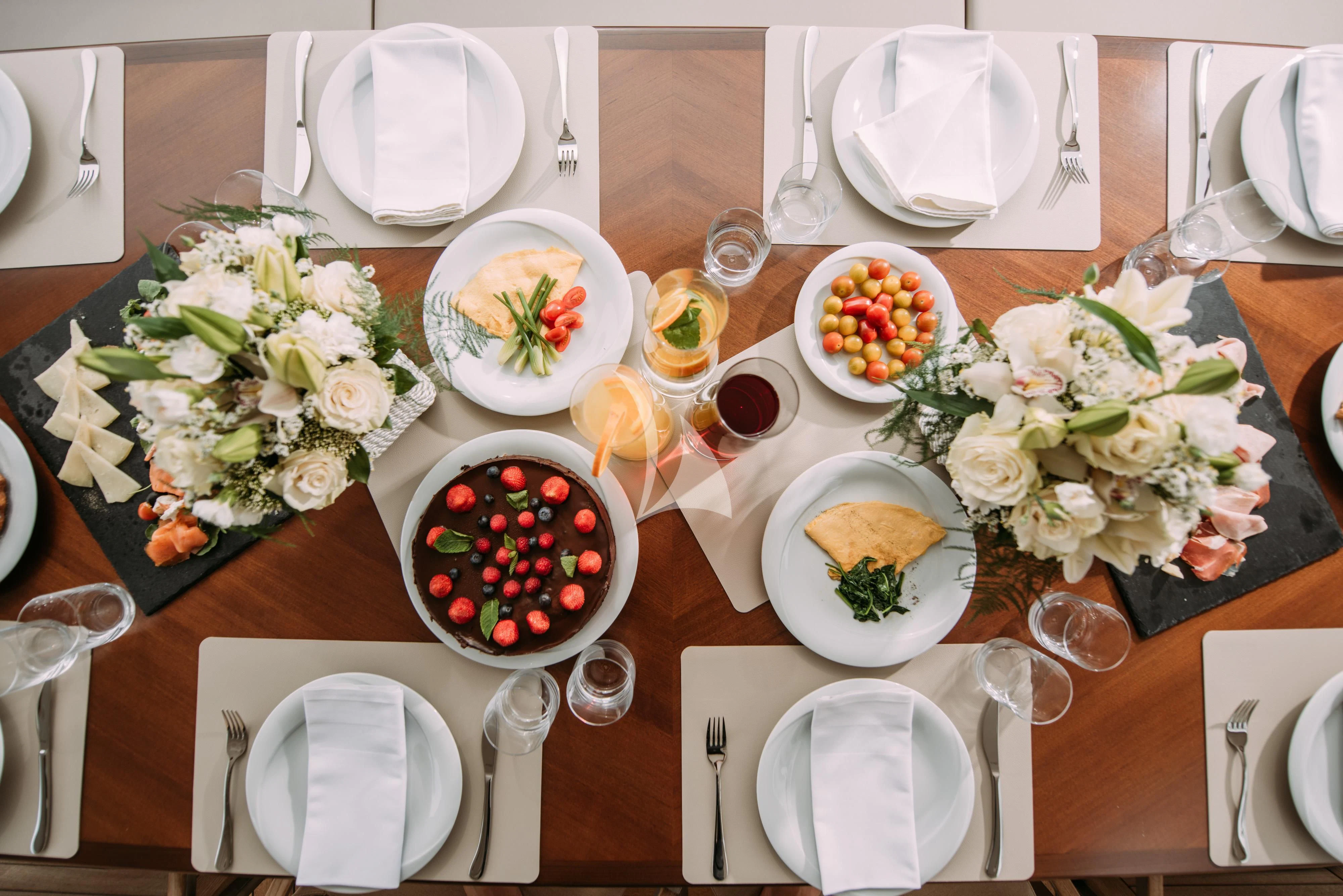 a table with plates and silverware aboard ARTEMY Yacht for Sale