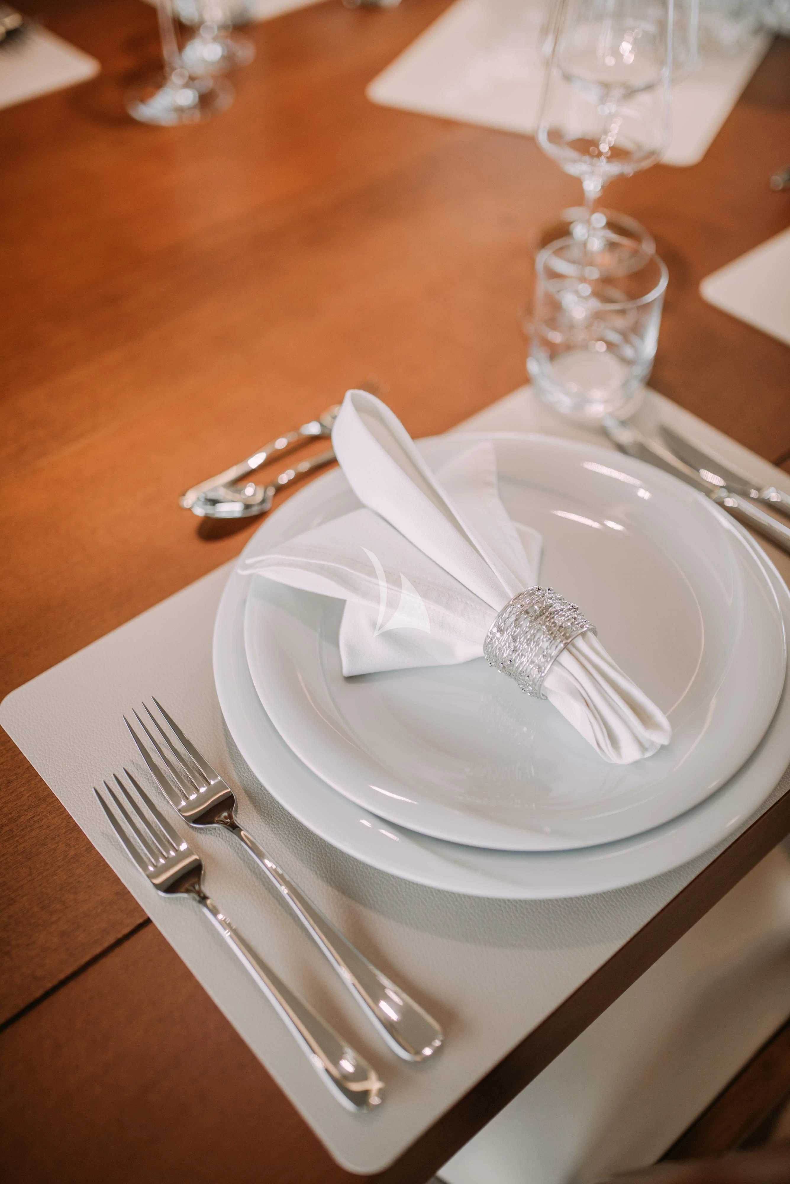 a plate with a fork and knife on it aboard ARTEMY Yacht for Sale