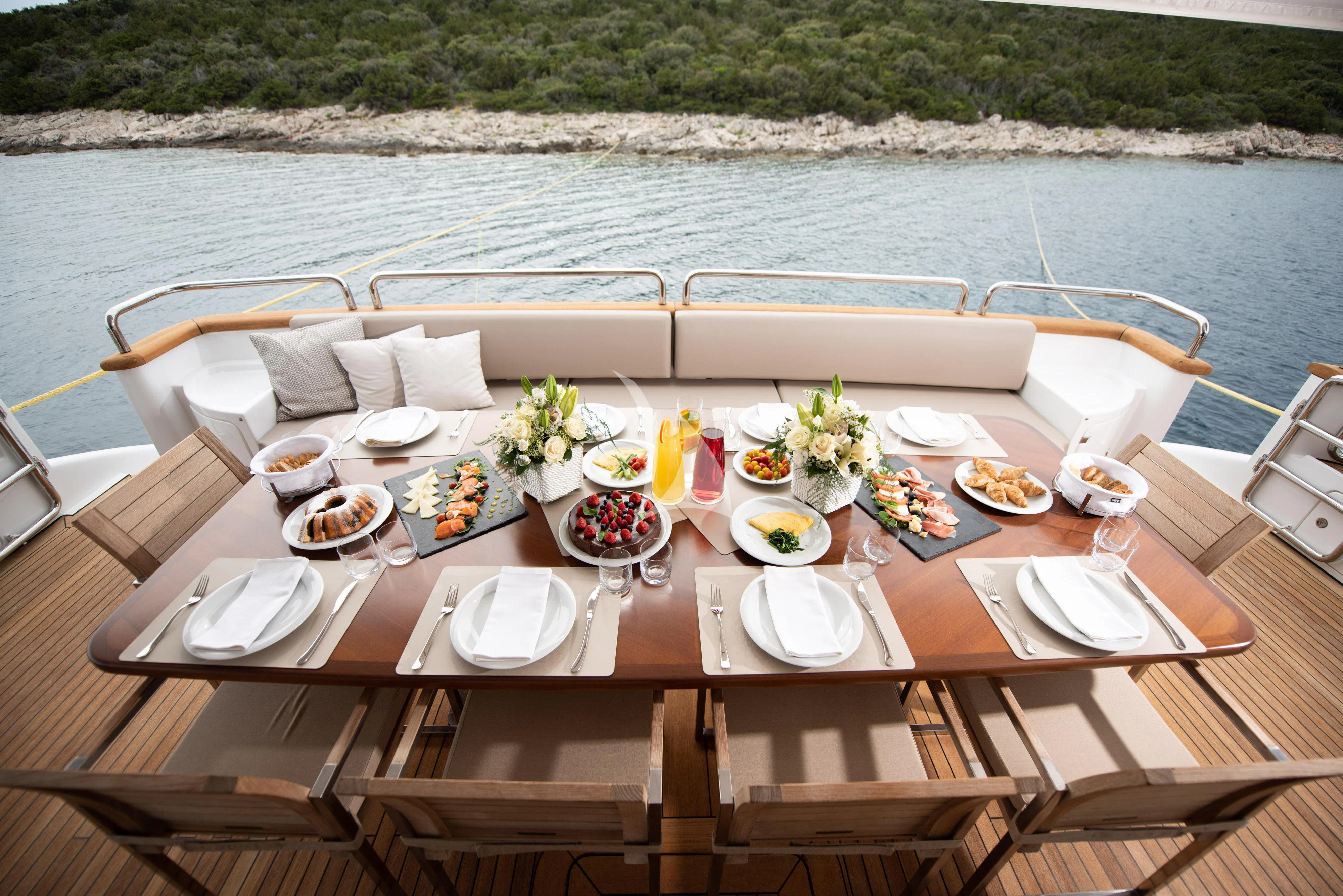 a table set for a meal on a boat aboard ARTEMY Yacht for Sale