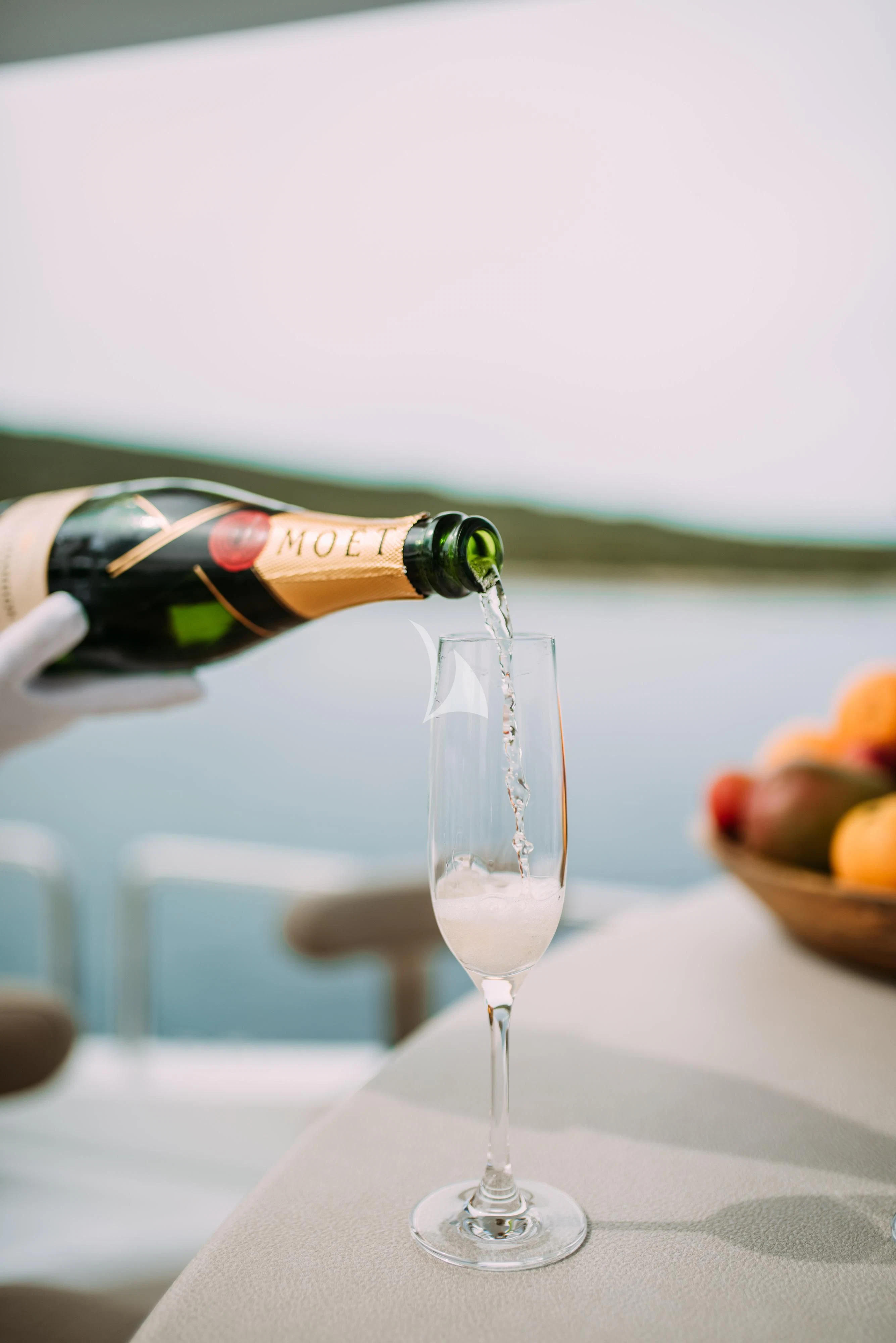 a bottle of wine and a glass aboard ARTEMY Yacht for Sale