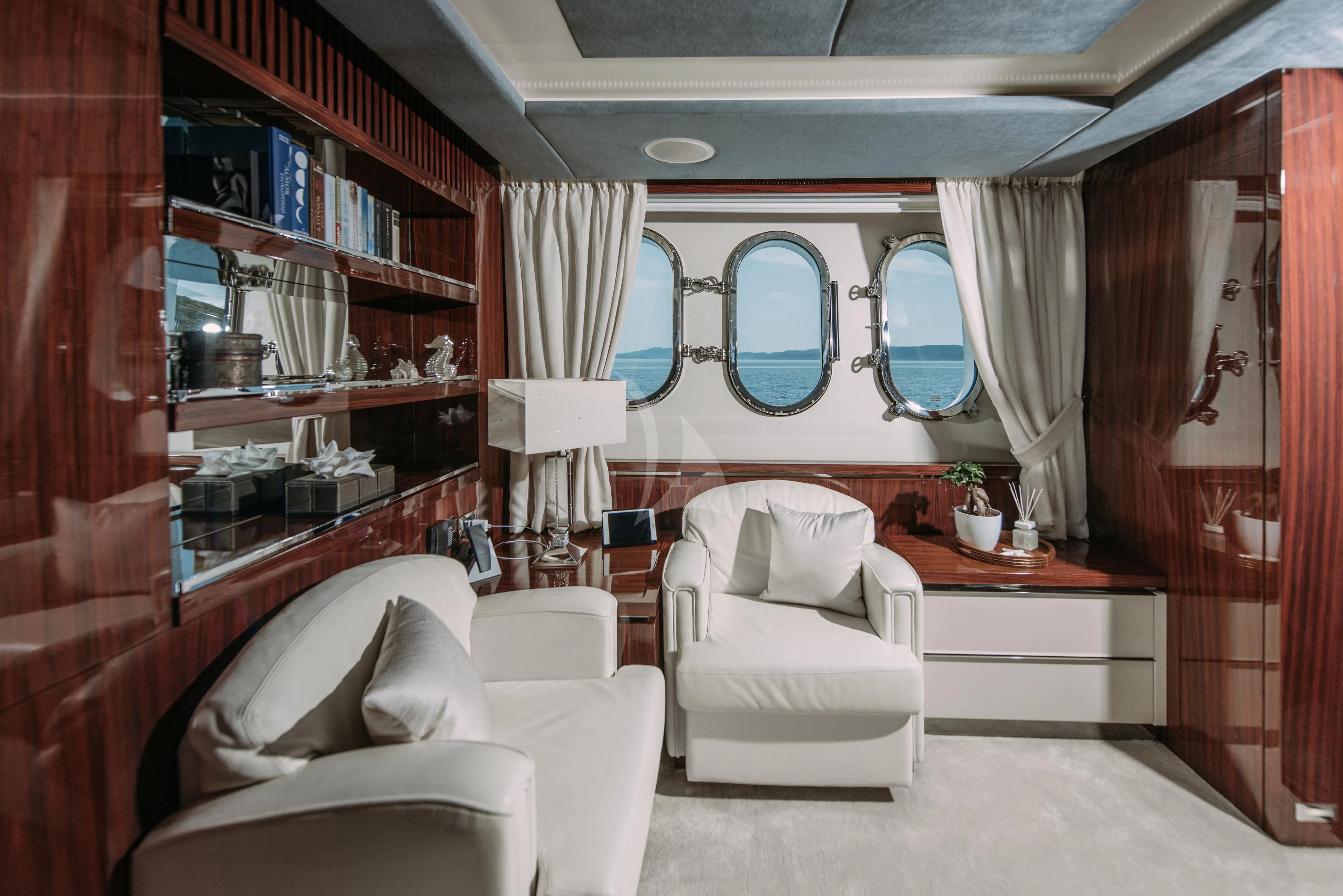a room with a bed and a mirror aboard ARTEMY Yacht for Sale