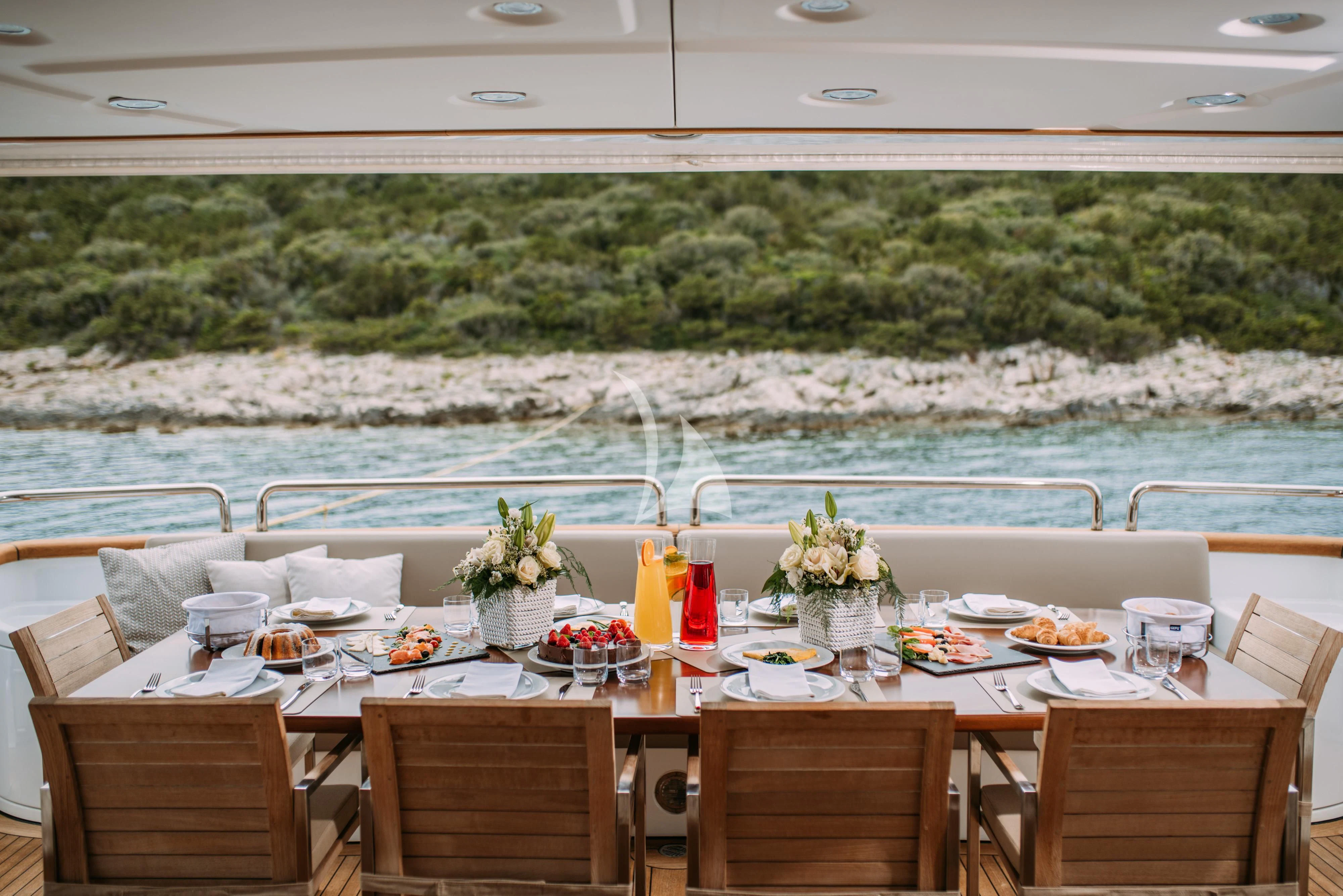 a table set for a meal on a boat aboard ARTEMY Yacht for Sale