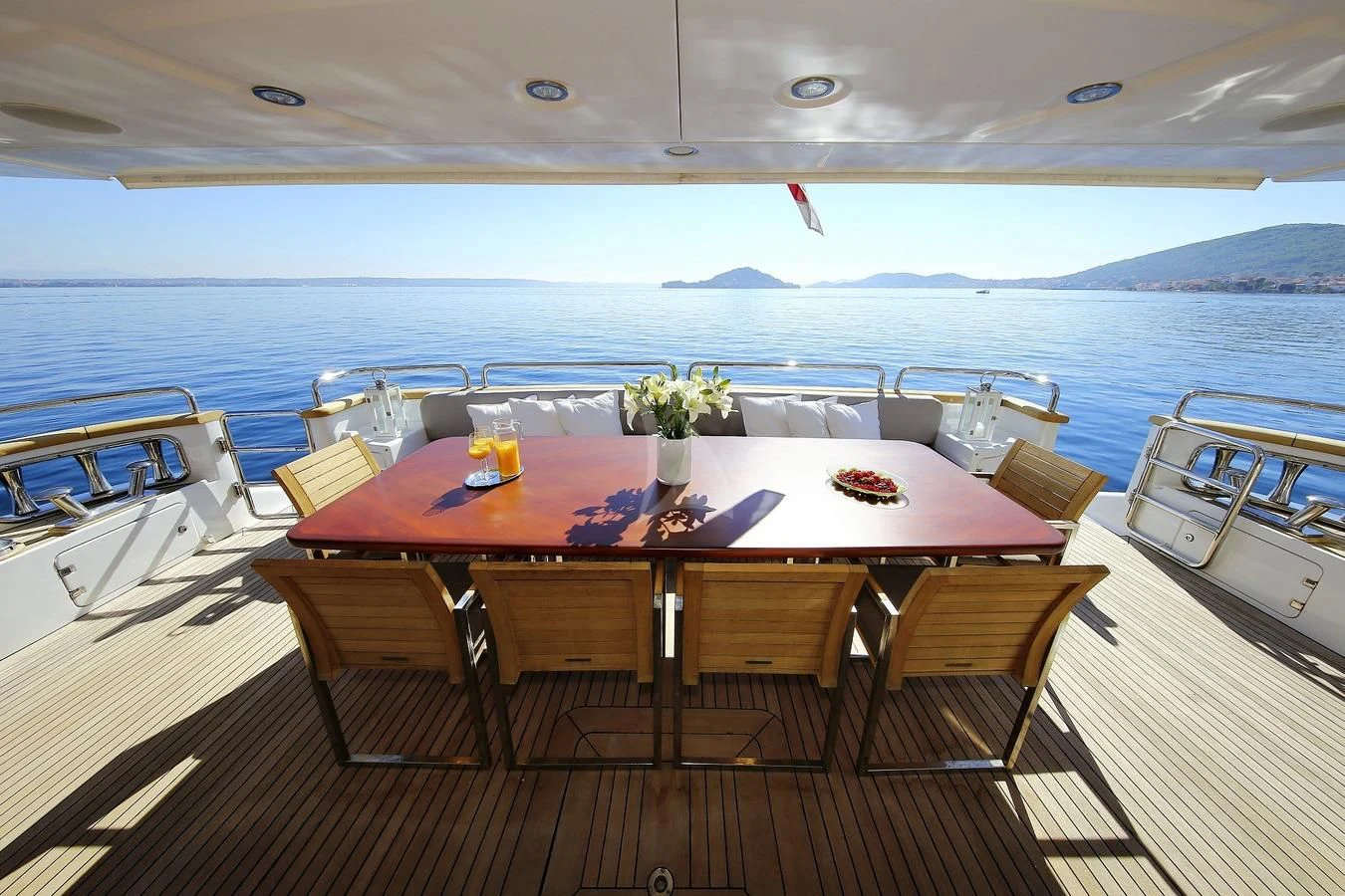 a table on a deck overlooking the ocean aboard ARTEMY Yacht for Sale