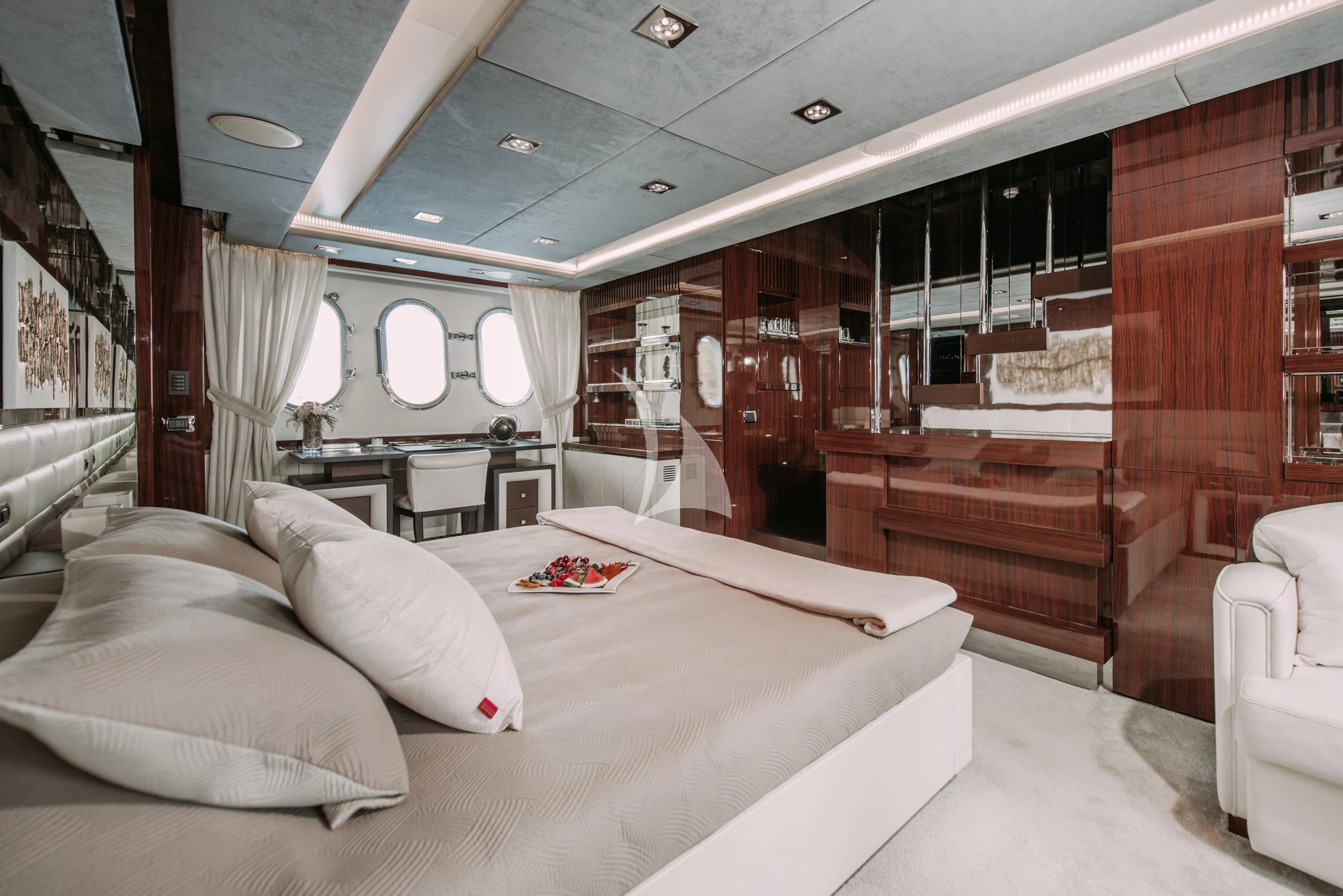 a room with a bed and a desk aboard ARTEMY Yacht for Sale