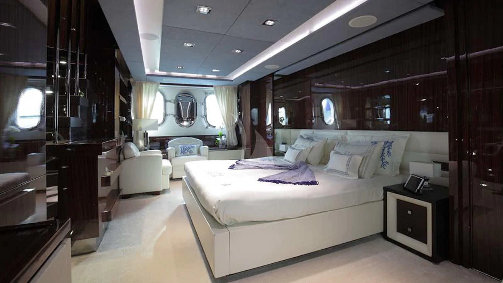 a room with a bed and a desk aboard ARTEMY Yacht for Sale