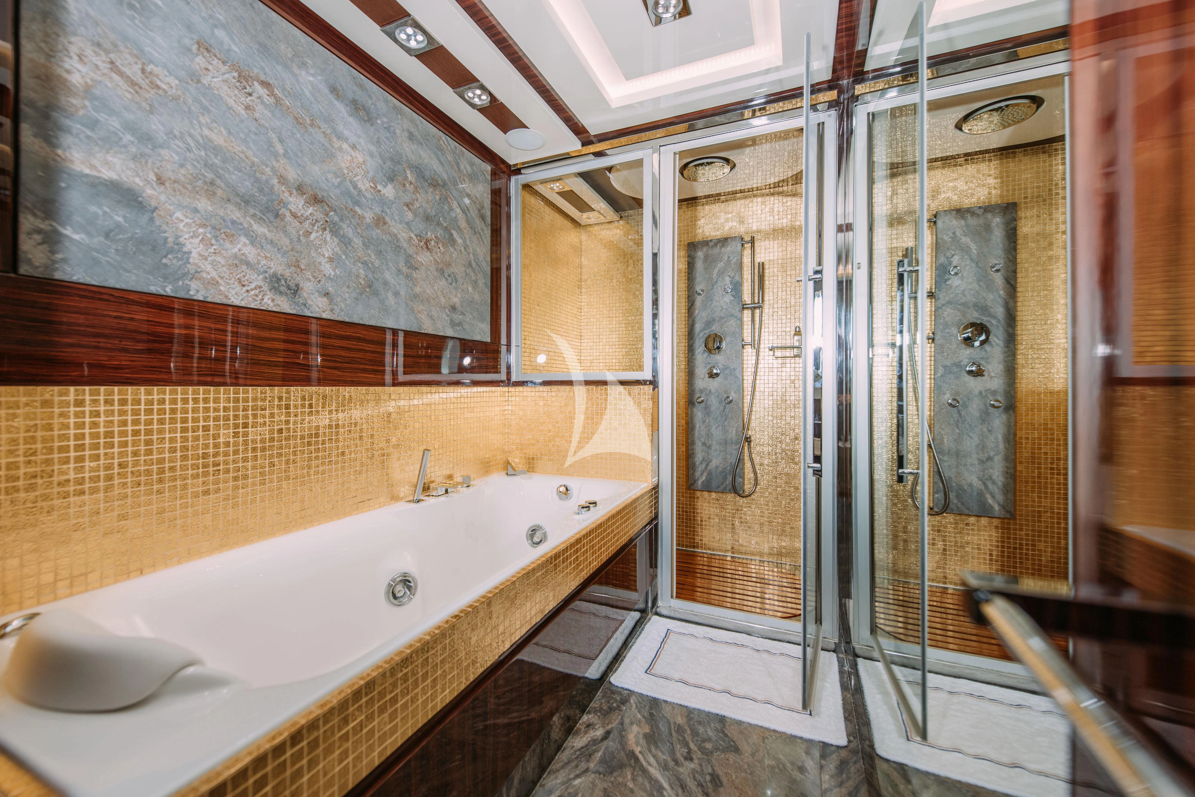 a bathroom with a large tub aboard ARTEMY Yacht for Sale