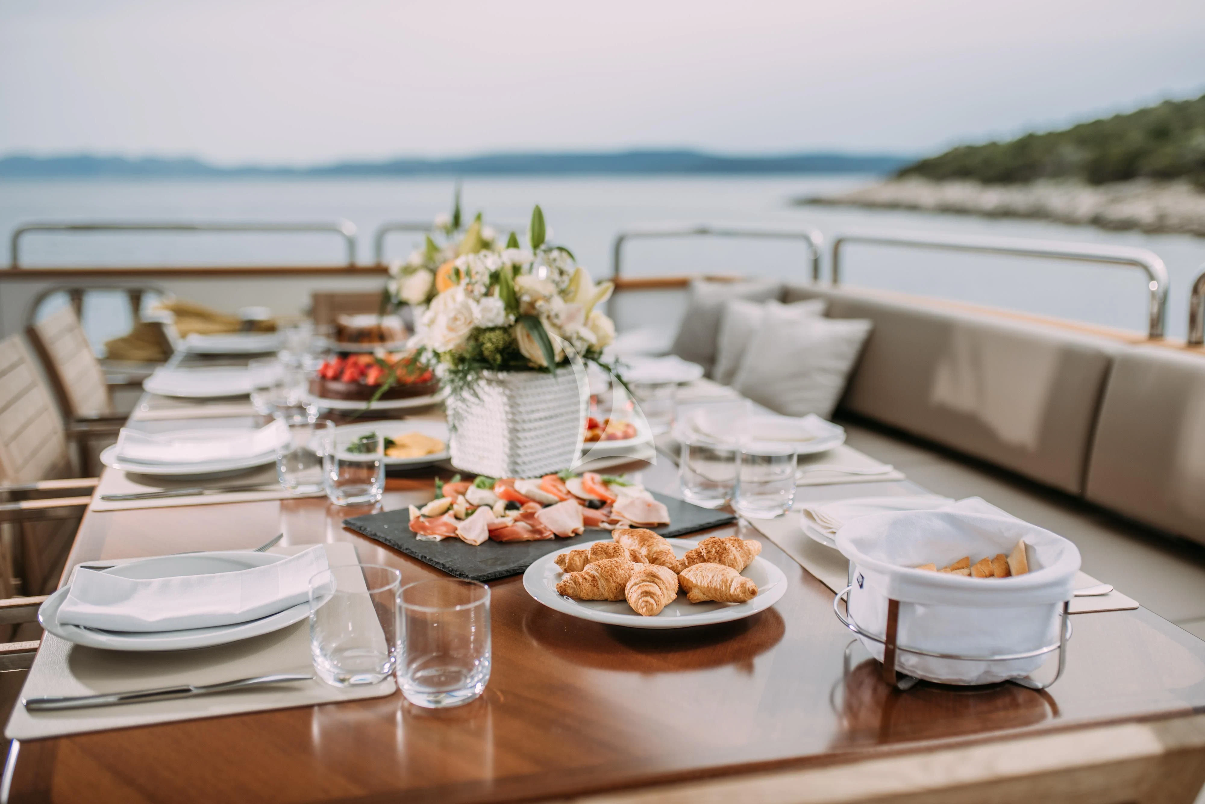 a table with food on it aboard ARTEMY Yacht for Sale