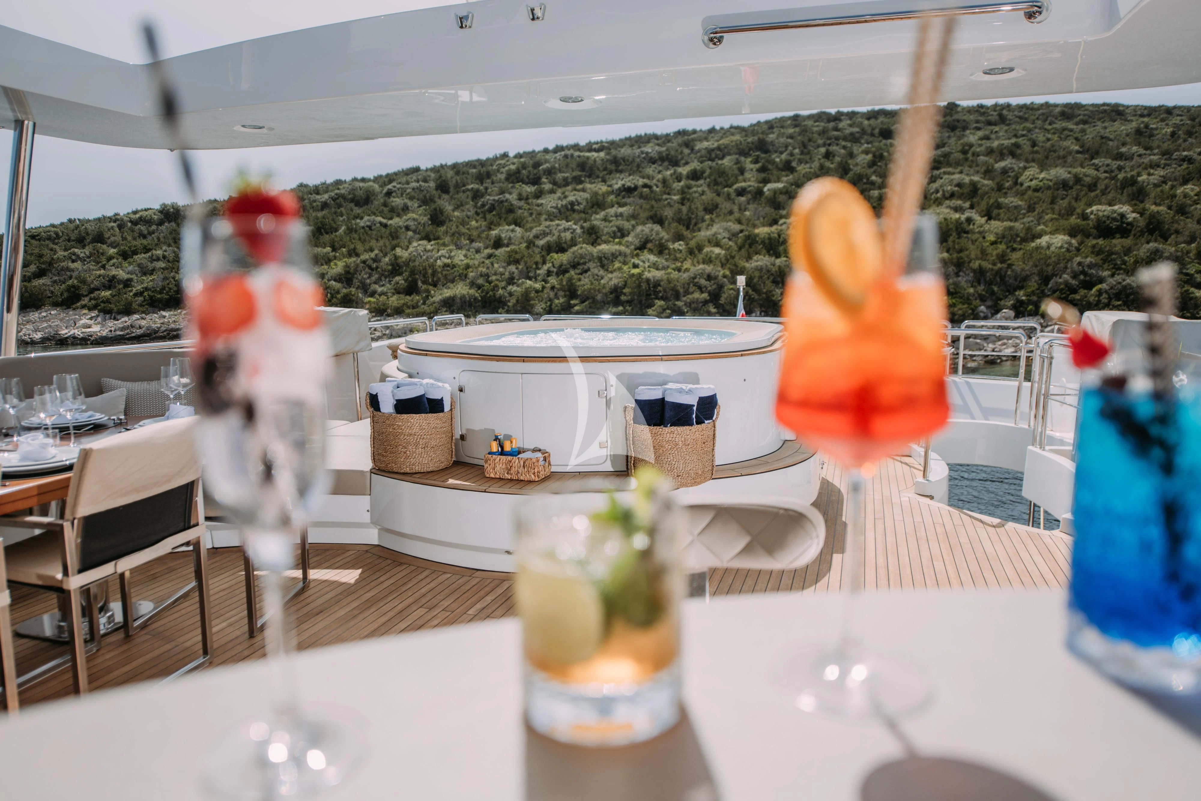 a table with drinks and fruits on it aboard ARTEMY Yacht for Sale