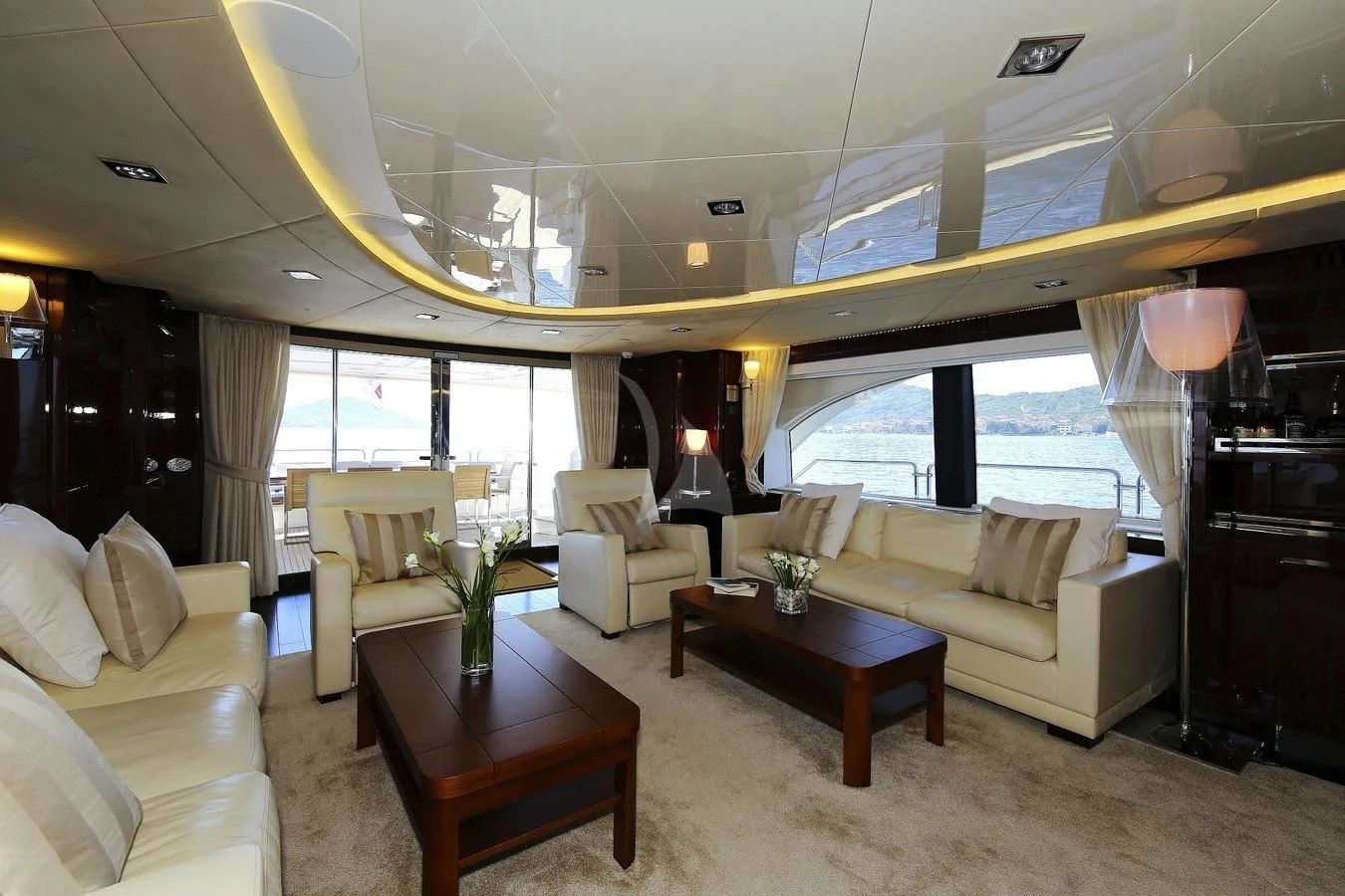 a living room with a large window aboard ARTEMY Yacht for Sale