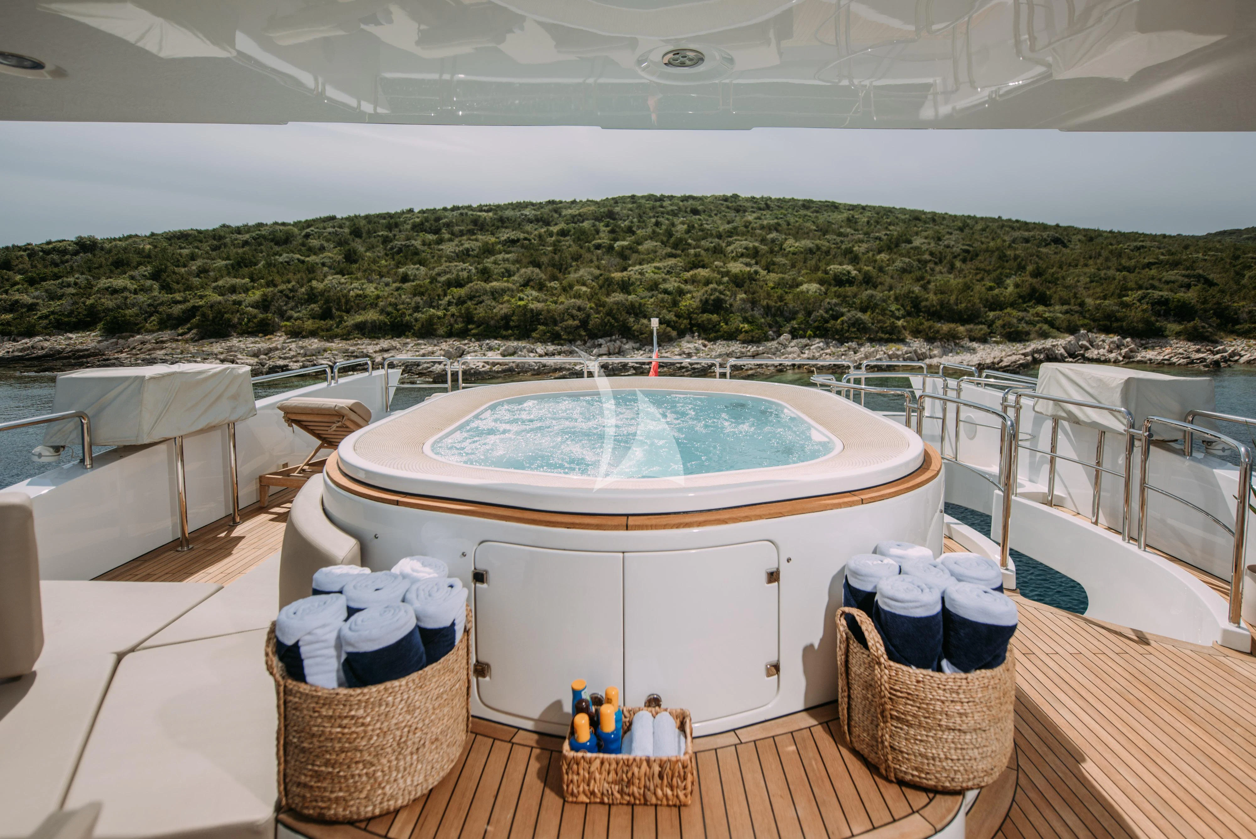 a balcony with a view of a city and a large body of water aboard ARTEMY Yacht for Sale