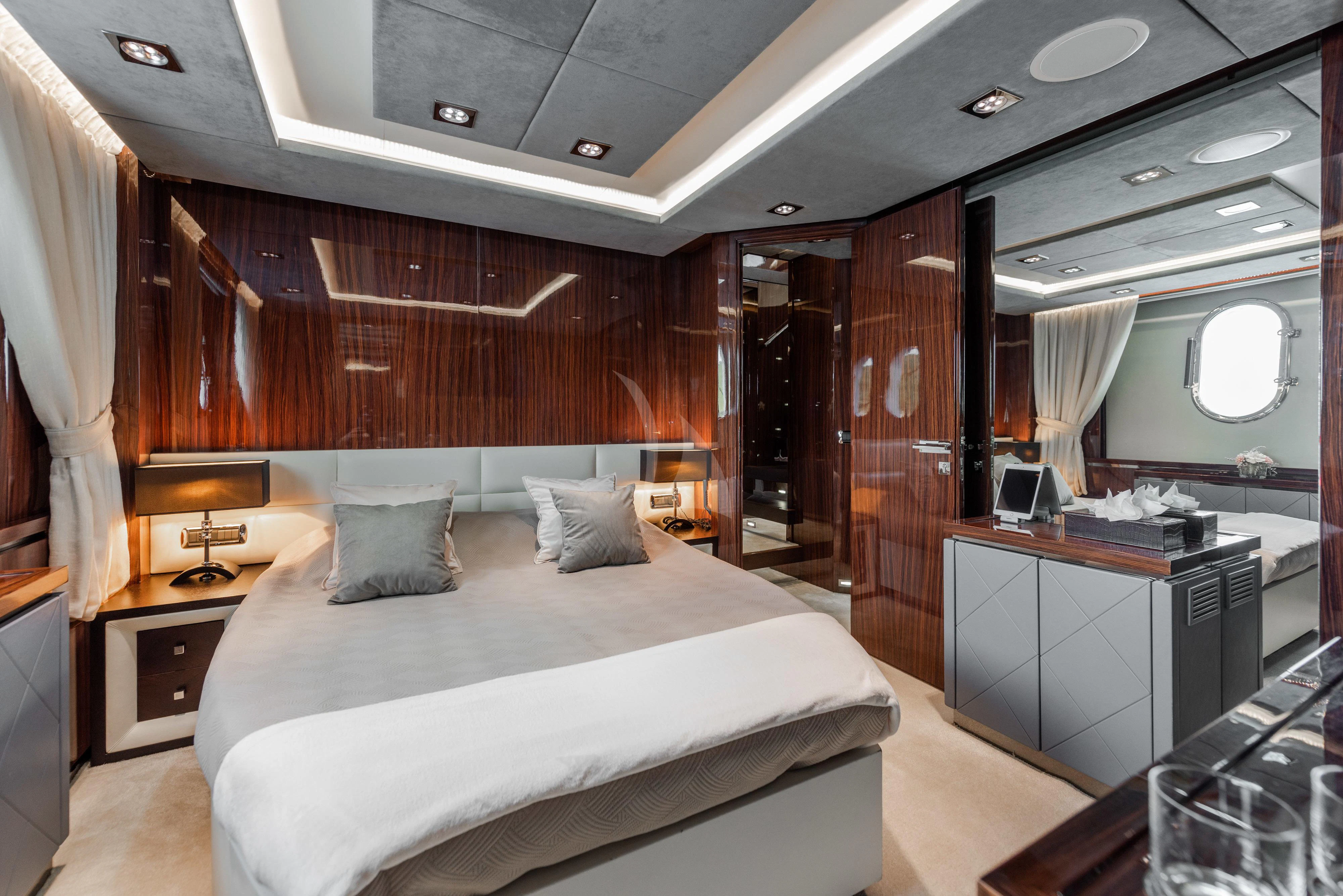 a room with a bed and a desk aboard ARTEMY Yacht for Sale